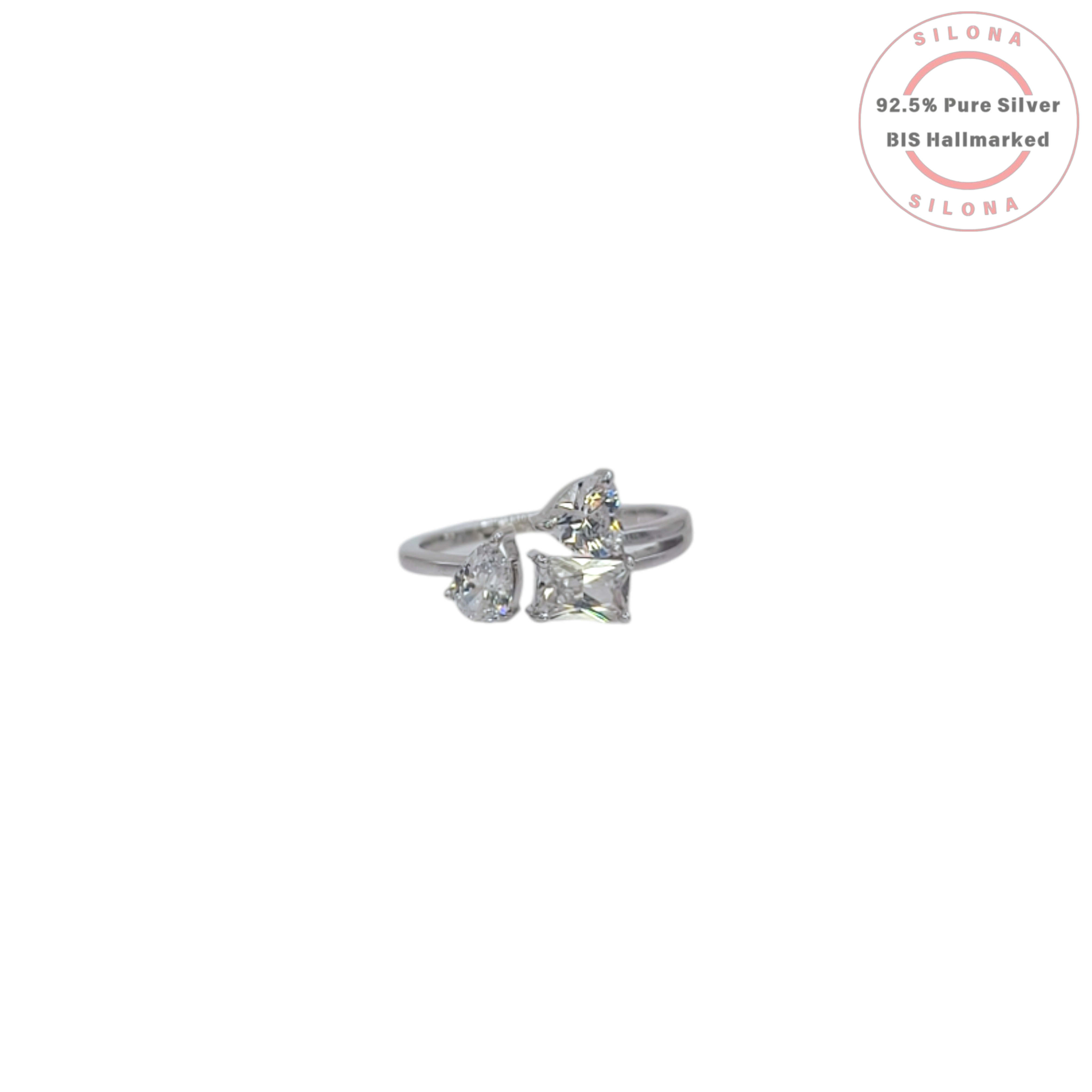 A modern crossover silver ring featuring three multi-shape clear cubic zirconia stones—a pear cut and a princess cut—on a polished band.