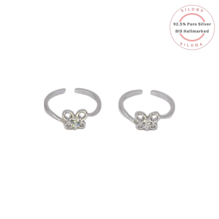 Pair of Silona silver toe rings featuring a delicate butterfly motif with clear cubic zirconia stones on a white background.