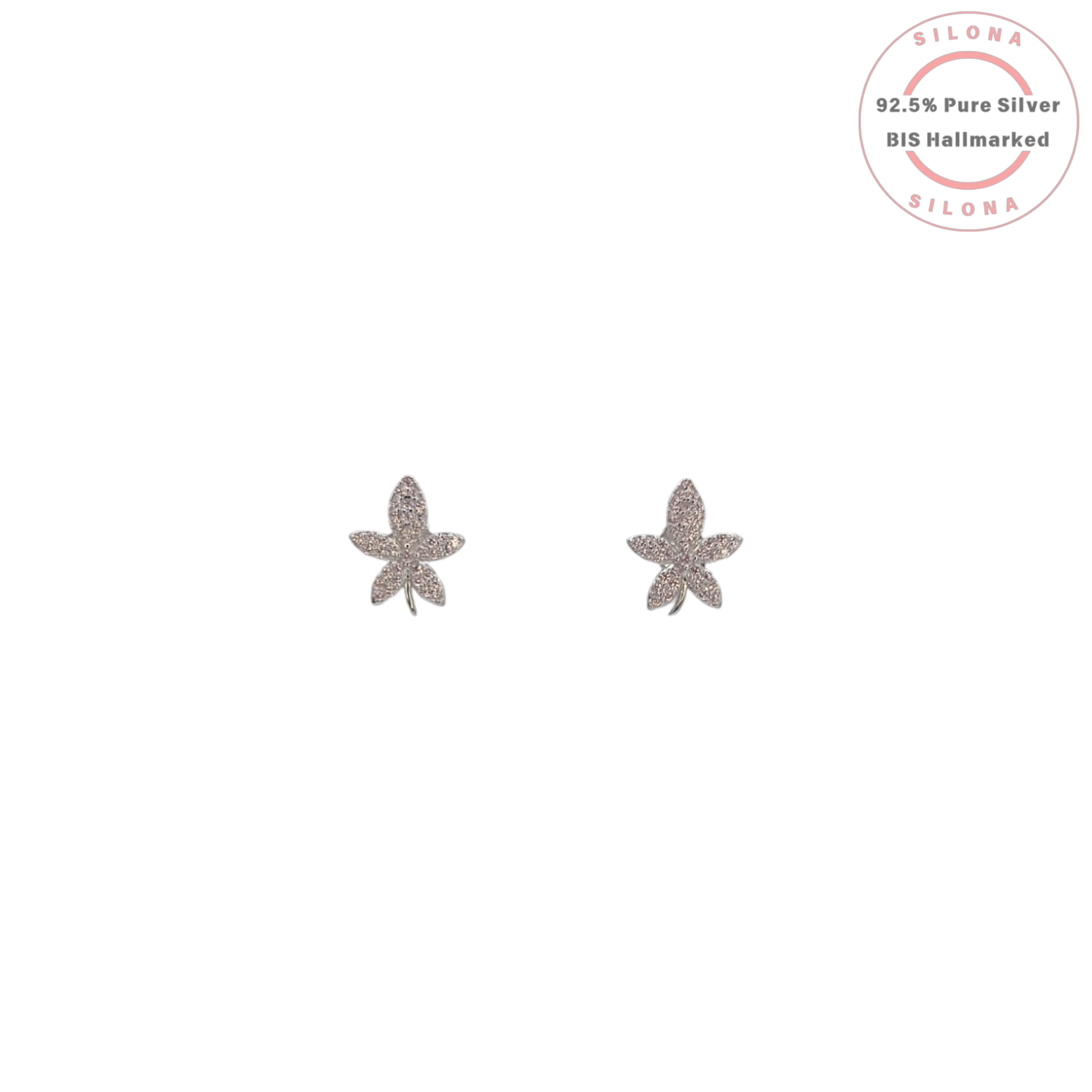 A pair of sterling silver floral stud earrings, fully paved with clear cubic zirconia, on a white background.