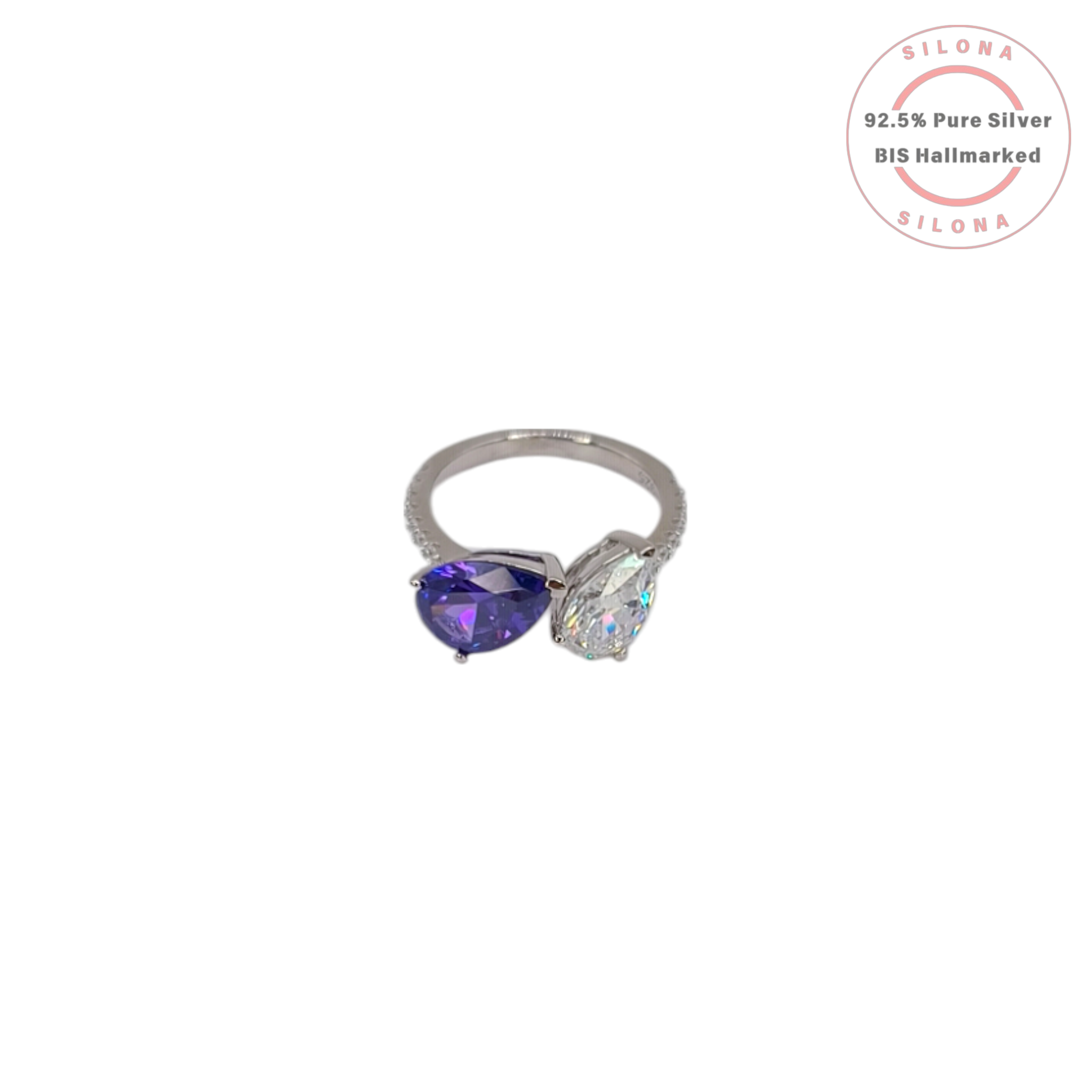Silona's Toi et Moi ring featuring a pear-cut amethyst-hue cubic zirconia and a clear cubic zirconia, set in 92.5 sterling silver on a white background.