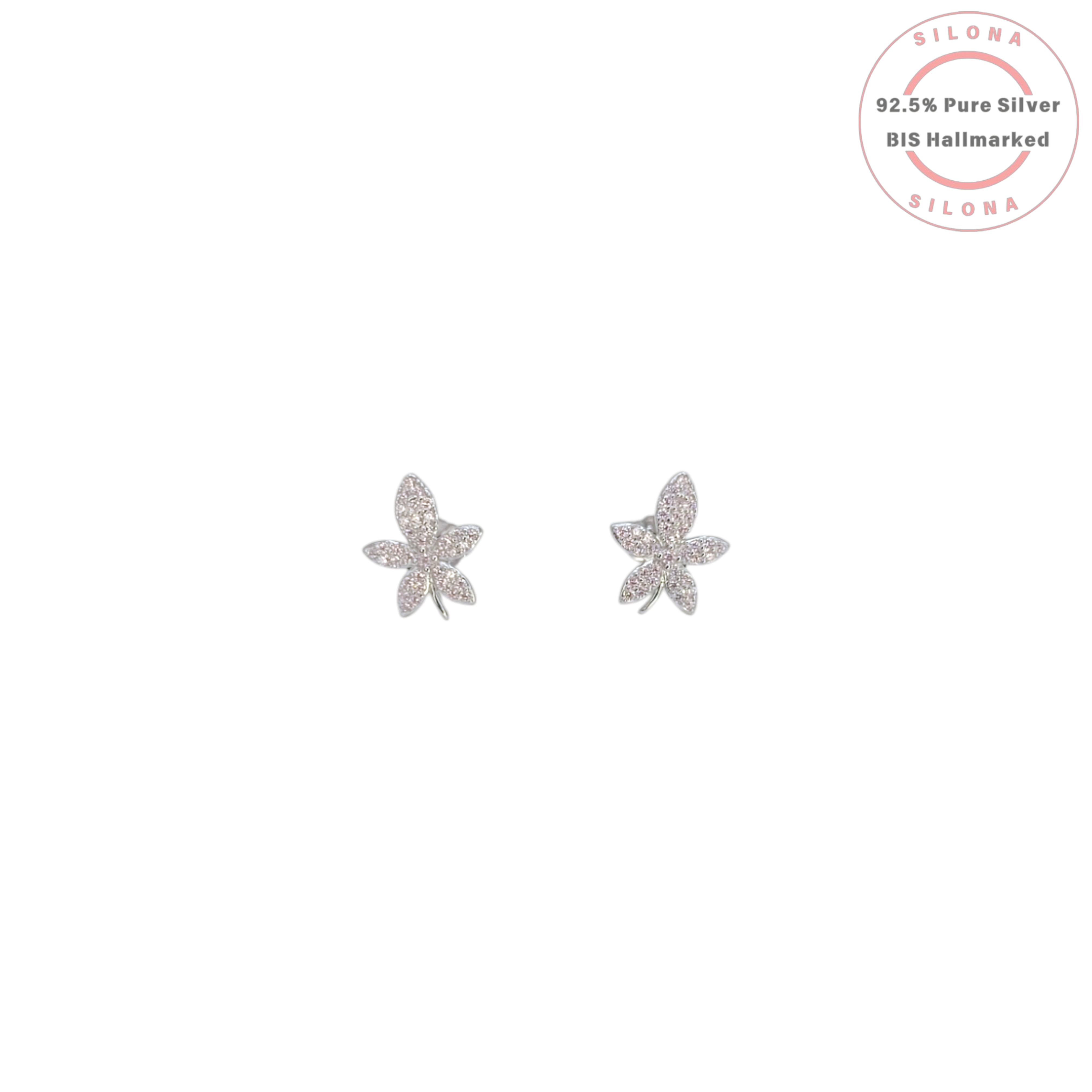 A pair of sterling silver floral stud earrings, fully paved with clear cubic zirconia, on a white background.