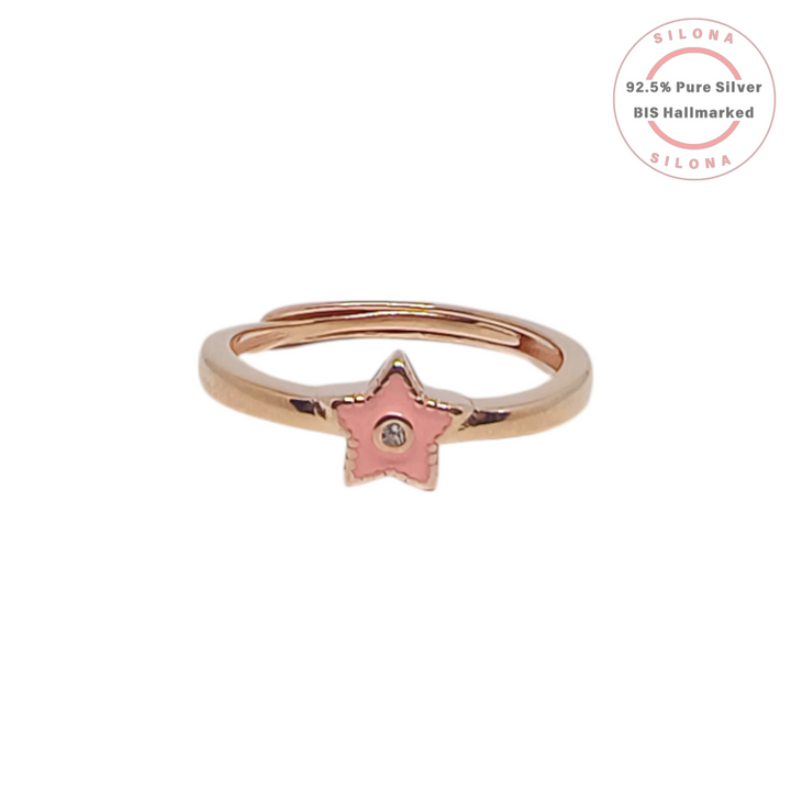 Silona's adjustable rose gold ring featuring a pink enamel star motif with a central cubic zirconia stone on a white background.