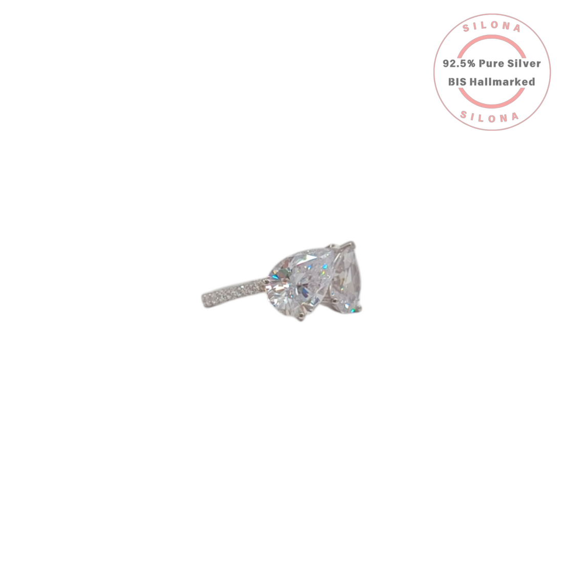 A modern Toi et Moi style ring crafted in 92.5 silver, featuring two large, pear-cut cubic zirconia stones on a white background.