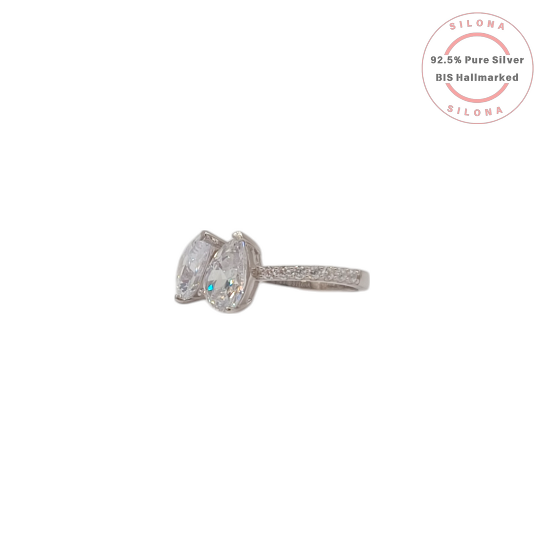 A modern Toi et Moi style ring crafted in 92.5 silver, featuring two large, pear-cut cubic zirconia stones on a white background.