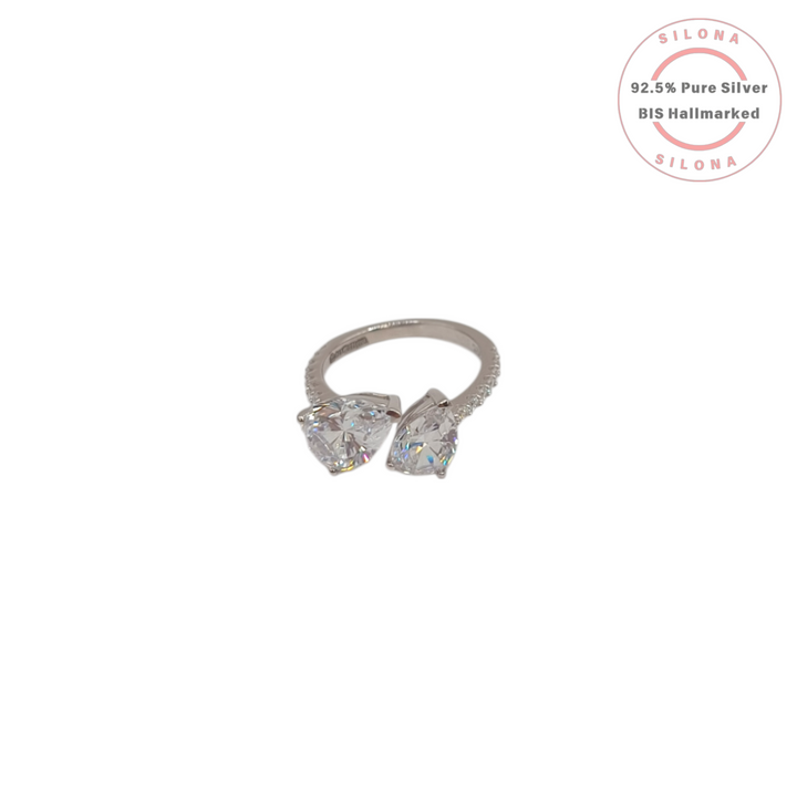 A modern Toi et Moi style ring crafted in 92.5 silver, featuring two large, pear-cut cubic zirconia stones on a white background.