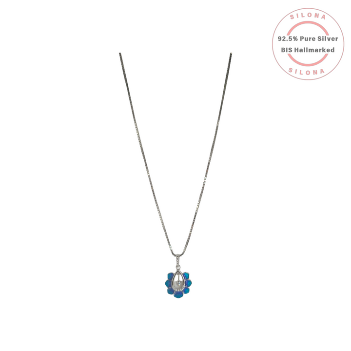 Silona Azure Lotus Bloom Necklace featuring a blue enamel floral pendant with a central cubic zirconia on a 92.5 silver box chain.