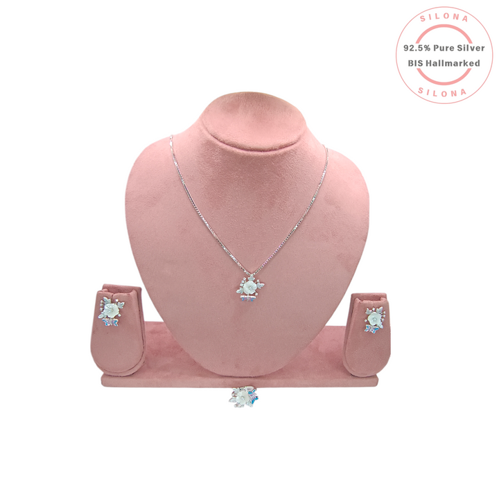 Silona Enchanted Butterfly & Flora necklace and earring set in 92.5 silver, displayed on a pink bust. The pendant features a mother-of-pearl flower and a blue butterfly.