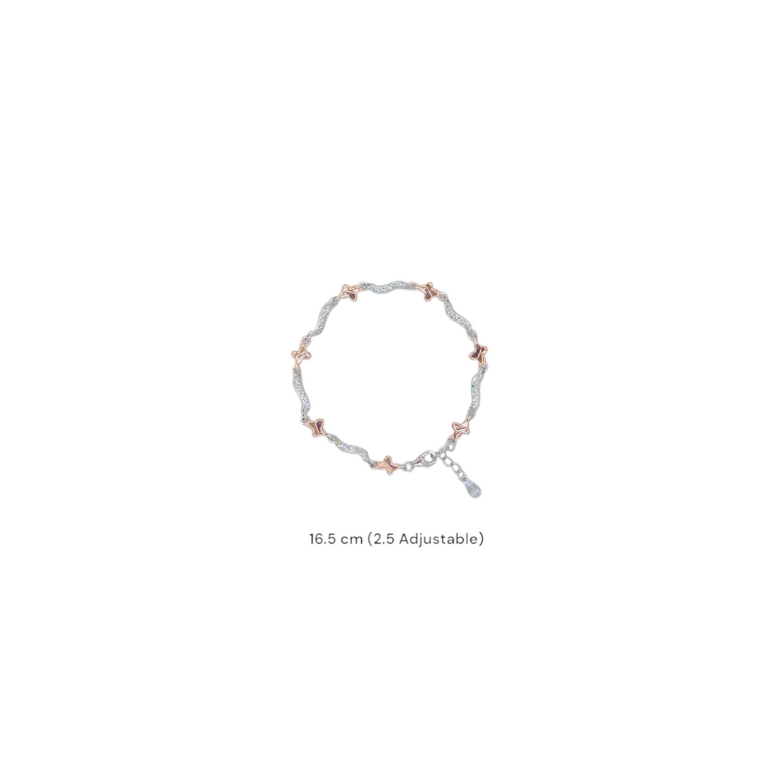 Delicate two-tone bracelet with rose gold butterfly motifs and cubic zirconia wavy links in 92.5 silver, on a white background.