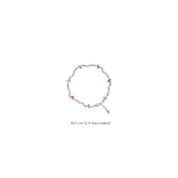 Delicate two-tone bracelet with rose gold butterfly motifs and cubic zirconia wavy links in 92.5 silver, on a white background.