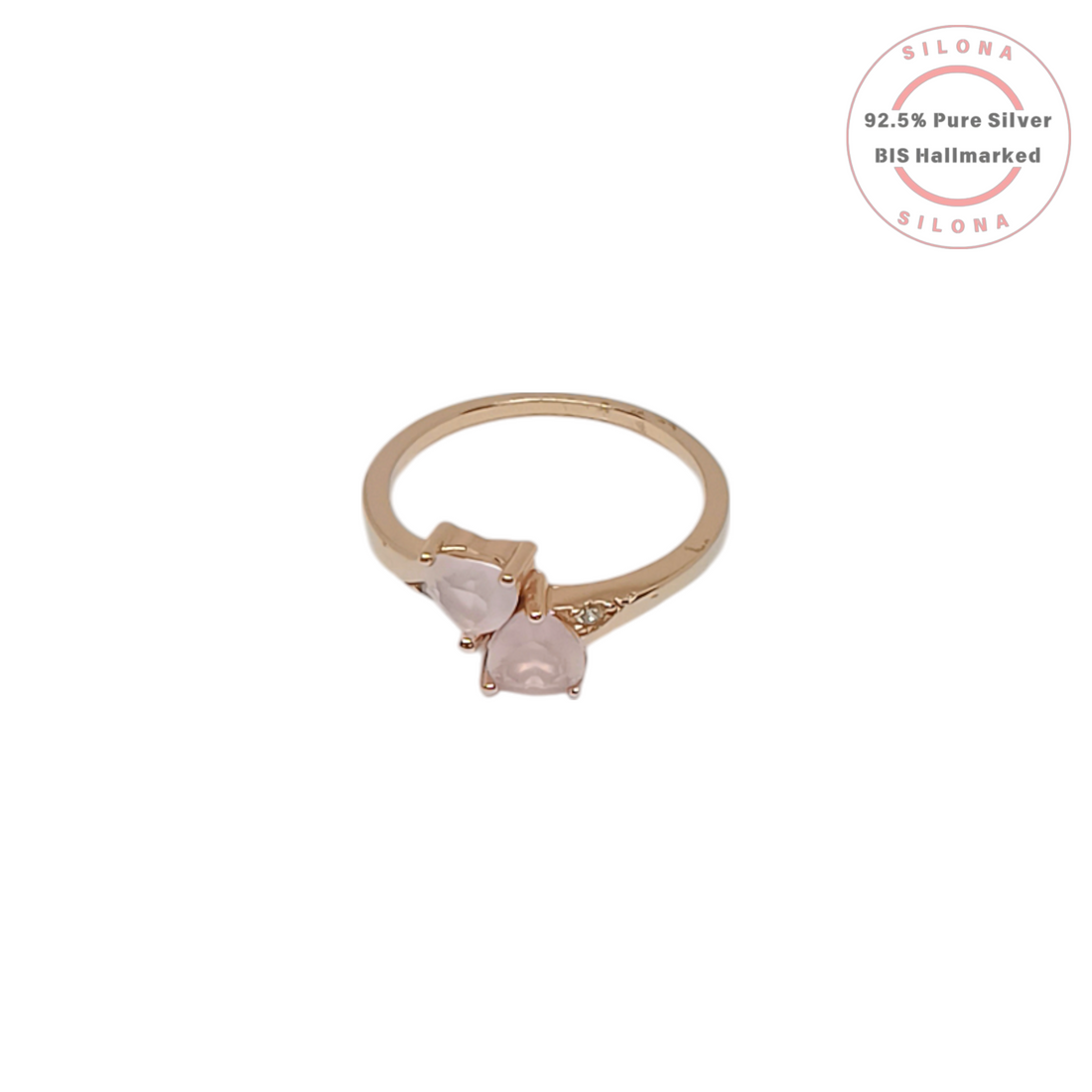 Toi et Moi style ring with two heart-shaped pink rose quartz stones on a rose gold plated 92.5 silver band.
