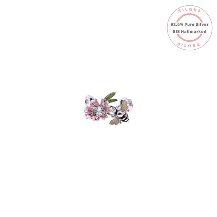 A silver honeycomb band ring featuring a detailed enamel bee and a pink enamel flower with a sparkling cubic zirconia center.