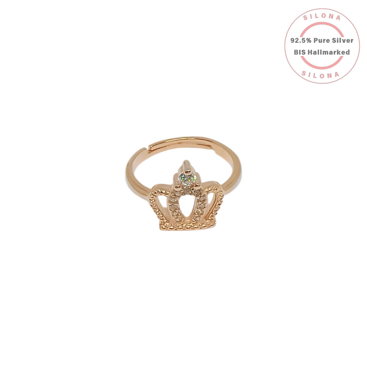 A close-up of the Silona Regal Crown Ring, featuring a rose gold plated silver band with a crown motif set with sparkling cubic zirconia stones, on a white background.