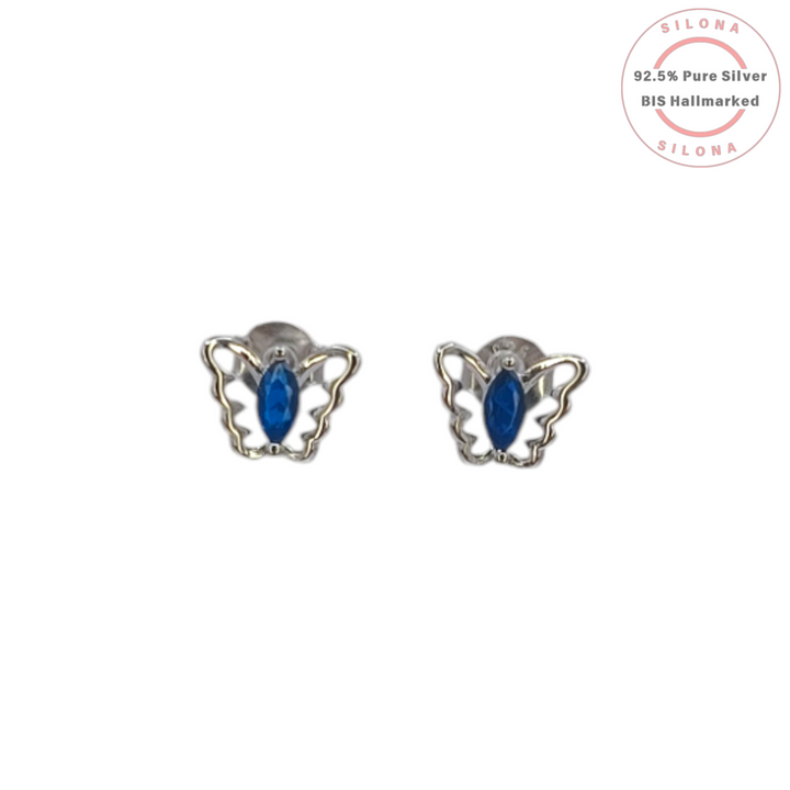 Pair of Silona silver butterfly stud earrings with a central marquise-cut sapphire-blue stone on a white background.