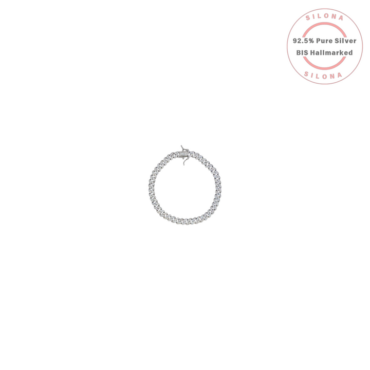 A men's iced out Cuban link bracelet made from 92.5 silver with a pavé setting of clear cubic zirconia, shown on a white background.