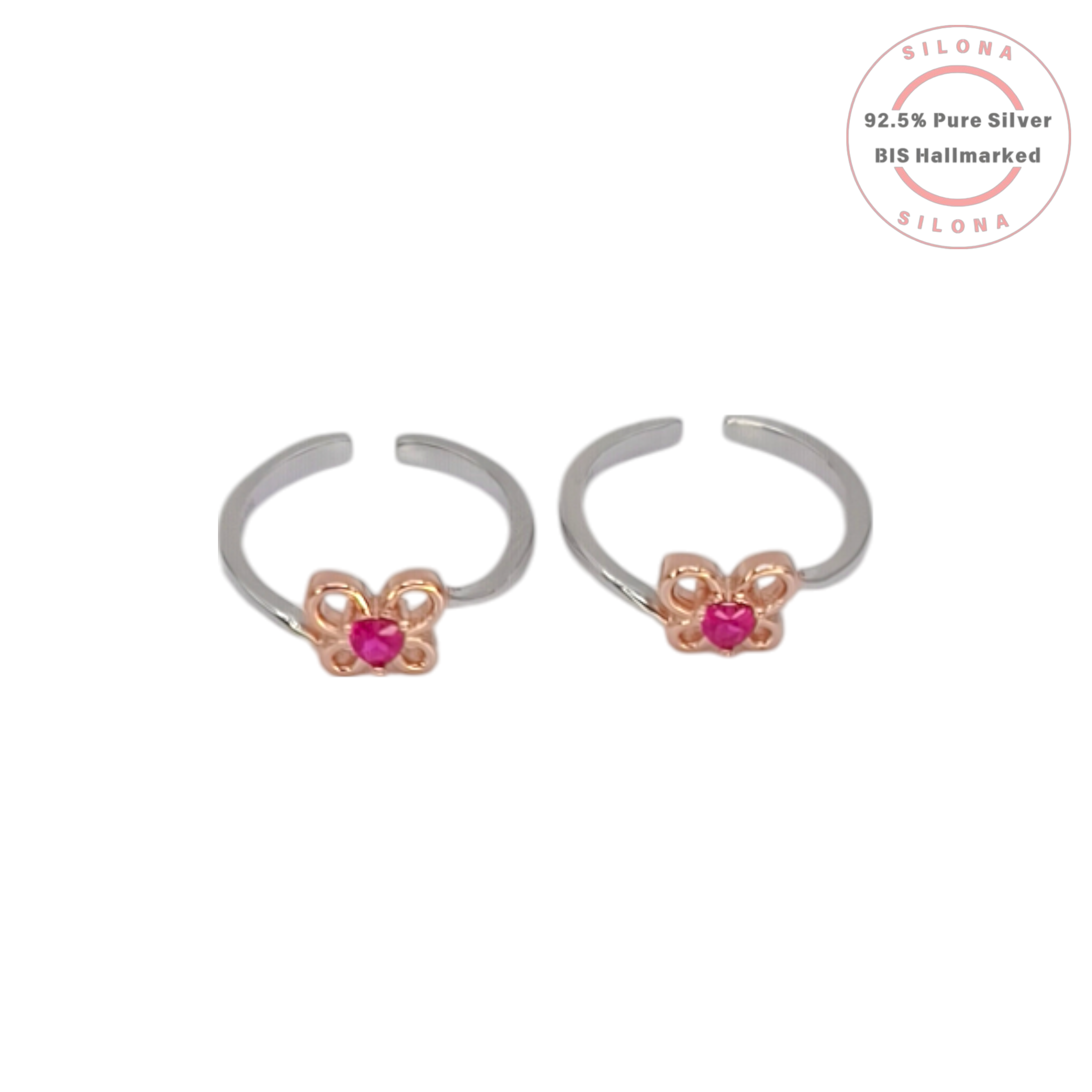 A pair of Silona silver toe rings featuring a rose gold butterfly design with a central pink heart-shaped stone, shown on a white background.