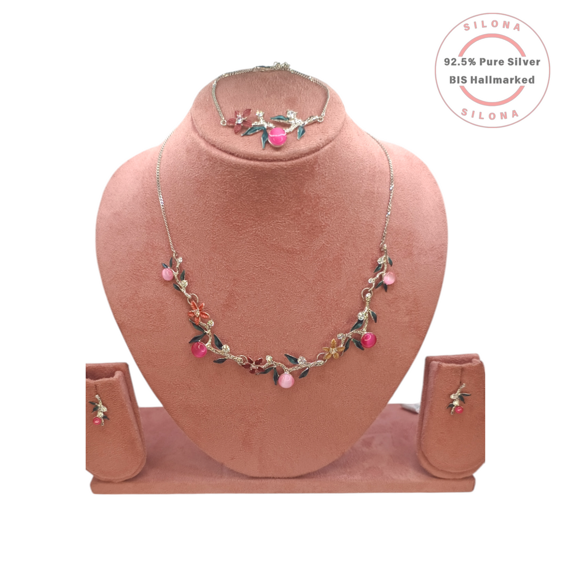 Silona Floral Vine necklace and earring set in 92.5 silver, displayed on a pink bust. The set features pink cat's-eye stones, colorful enamel flowers, and clear Cubic Zirconia.