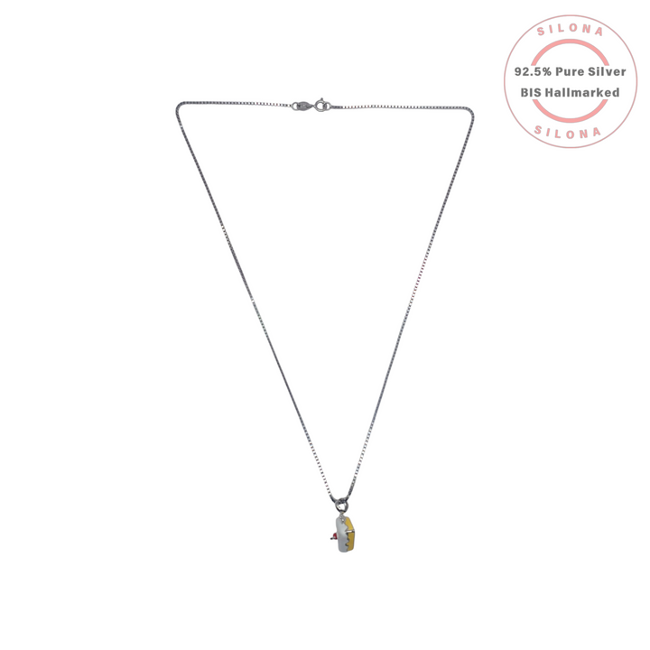 Silona Whimsical Cake Slice Enamel Necklace in 92.5 silver, featuring a yellow and white pendant with a red cherry detail, on a silver box chain.