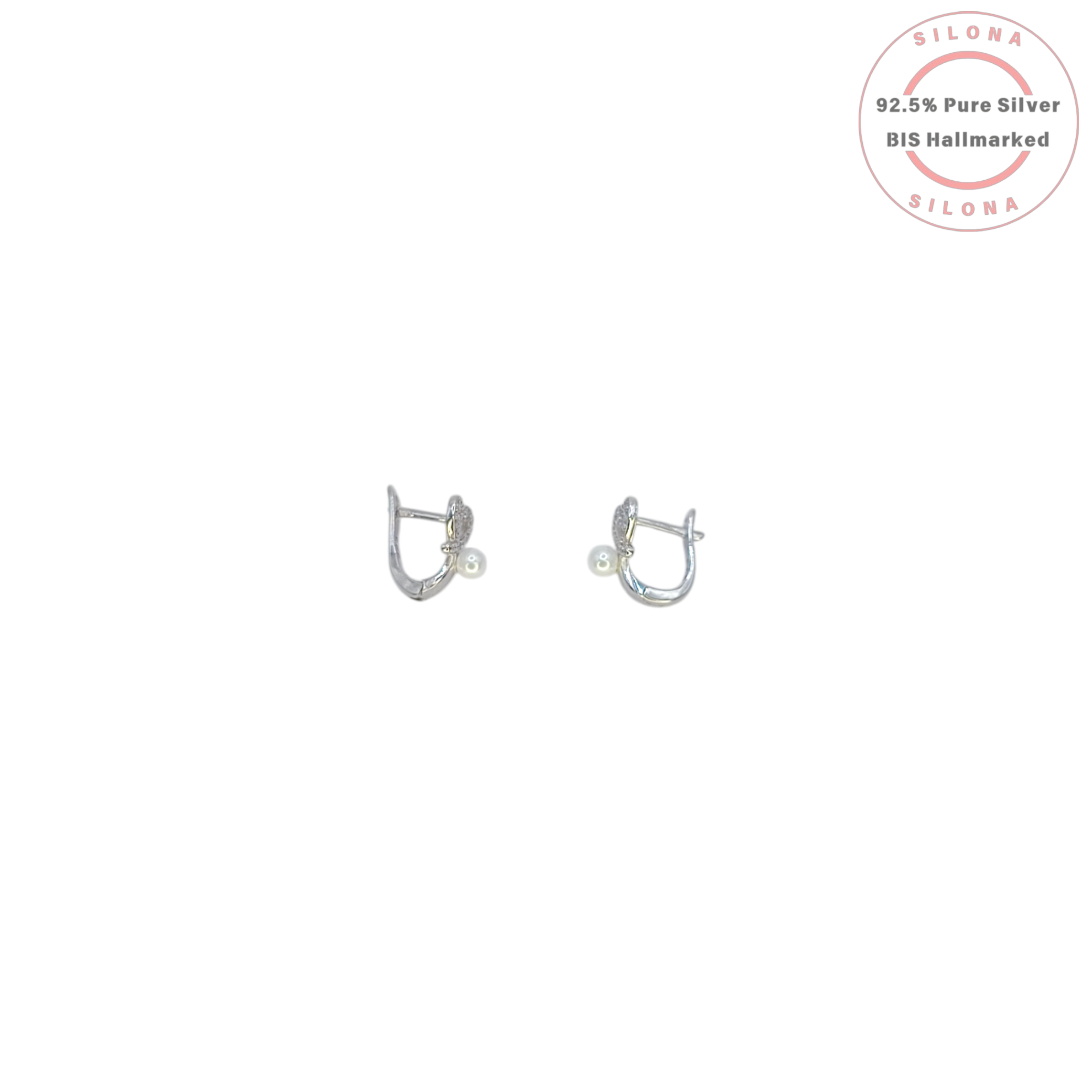 A pair of silver heart-shaped earrings paved with cubic zirconia, each featuring a single dangling pearl, on a clean white background.