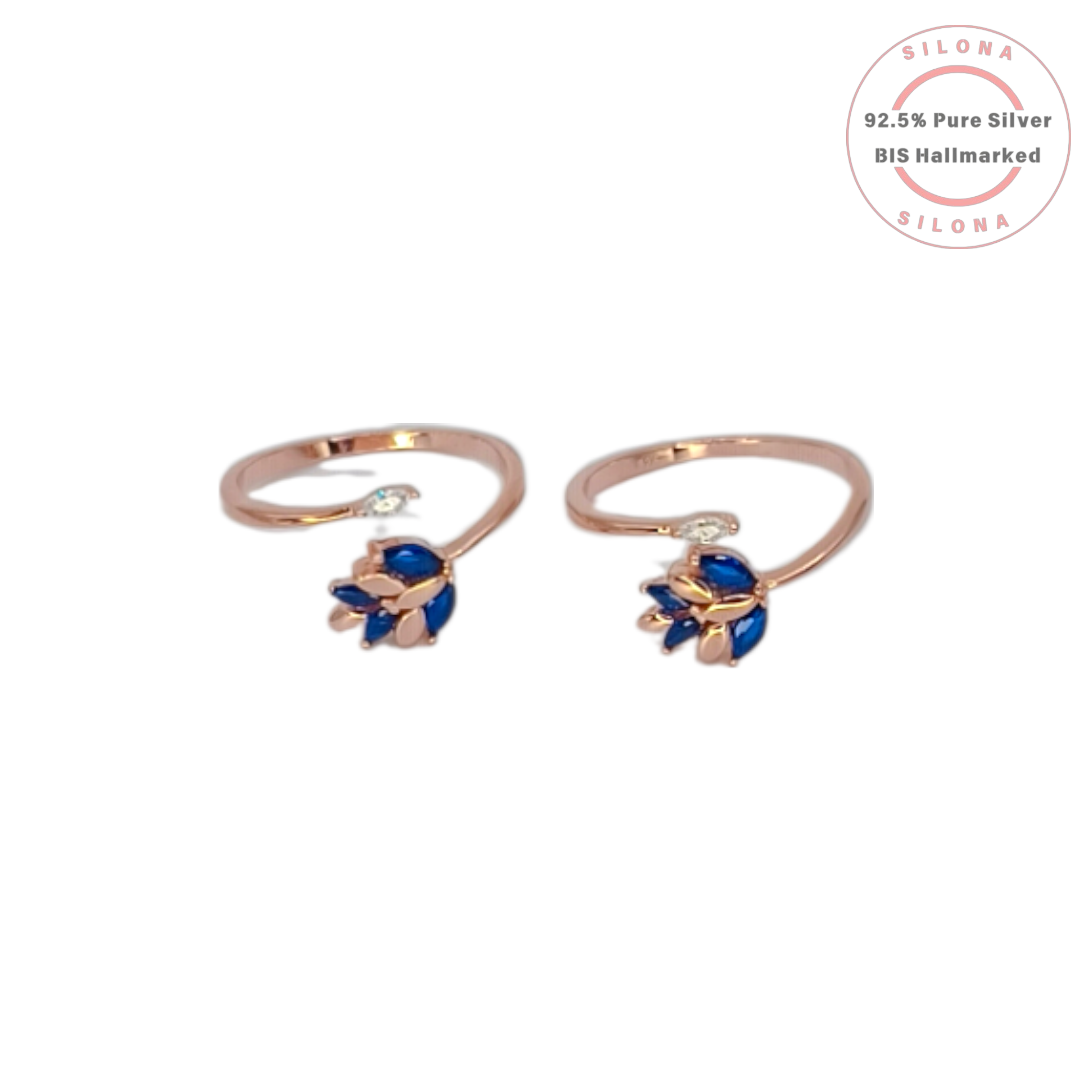 Pair of rose gold plated 92.5 silver toe rings with a floral leaf motif made of sapphire-blue marquise stones, on a white background.