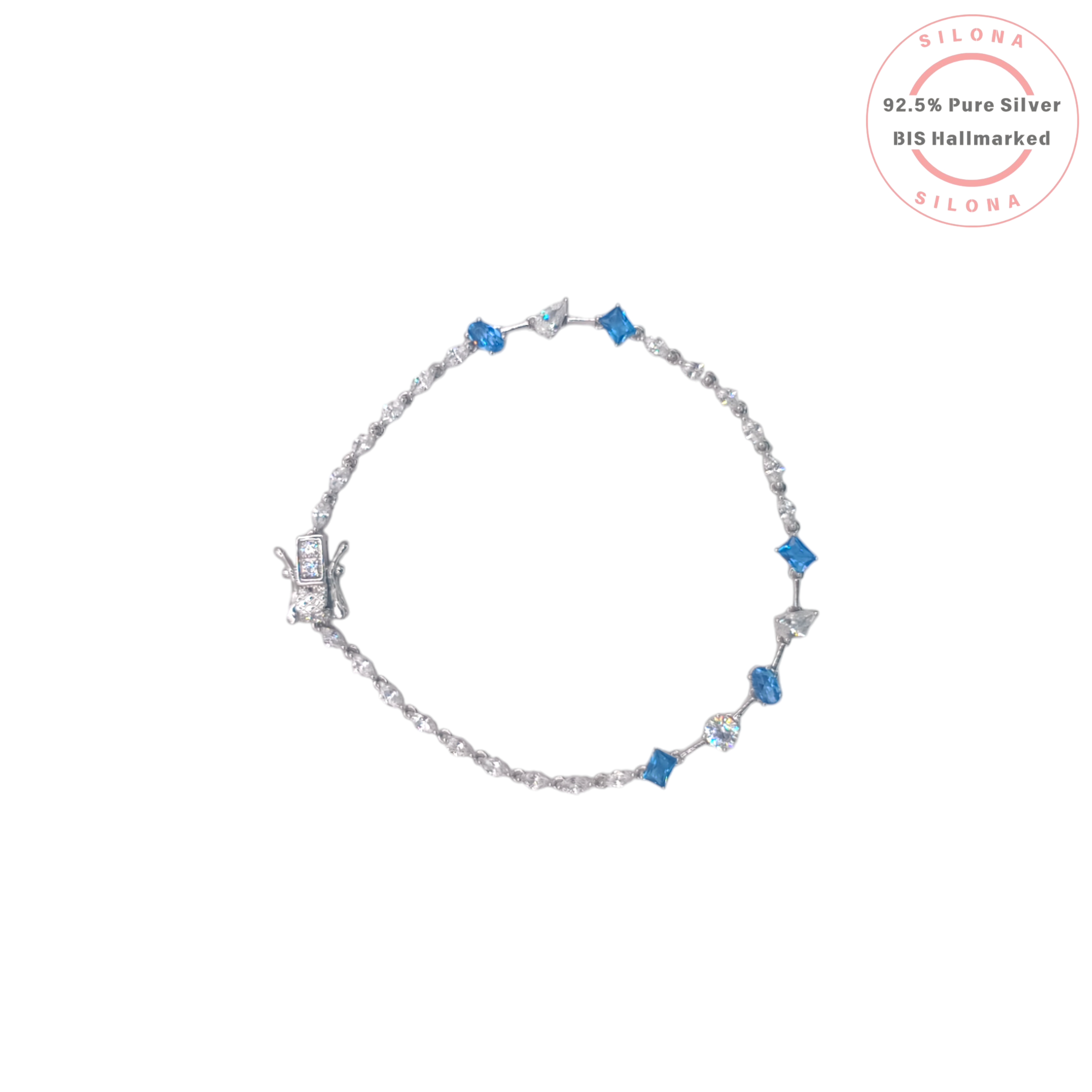 A modern silver tennis bracelet with alternating sapphire-blue and clear cubic zirconia stones in mixed cuts, on a white background.