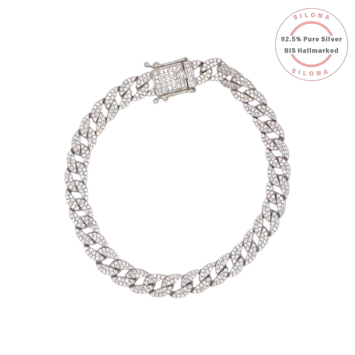 A men's iced out curb link bracelet, crafted from 92.5 silver and fully pavé-set with clear cubic zirconia, featuring a box clasp, on a white background.
