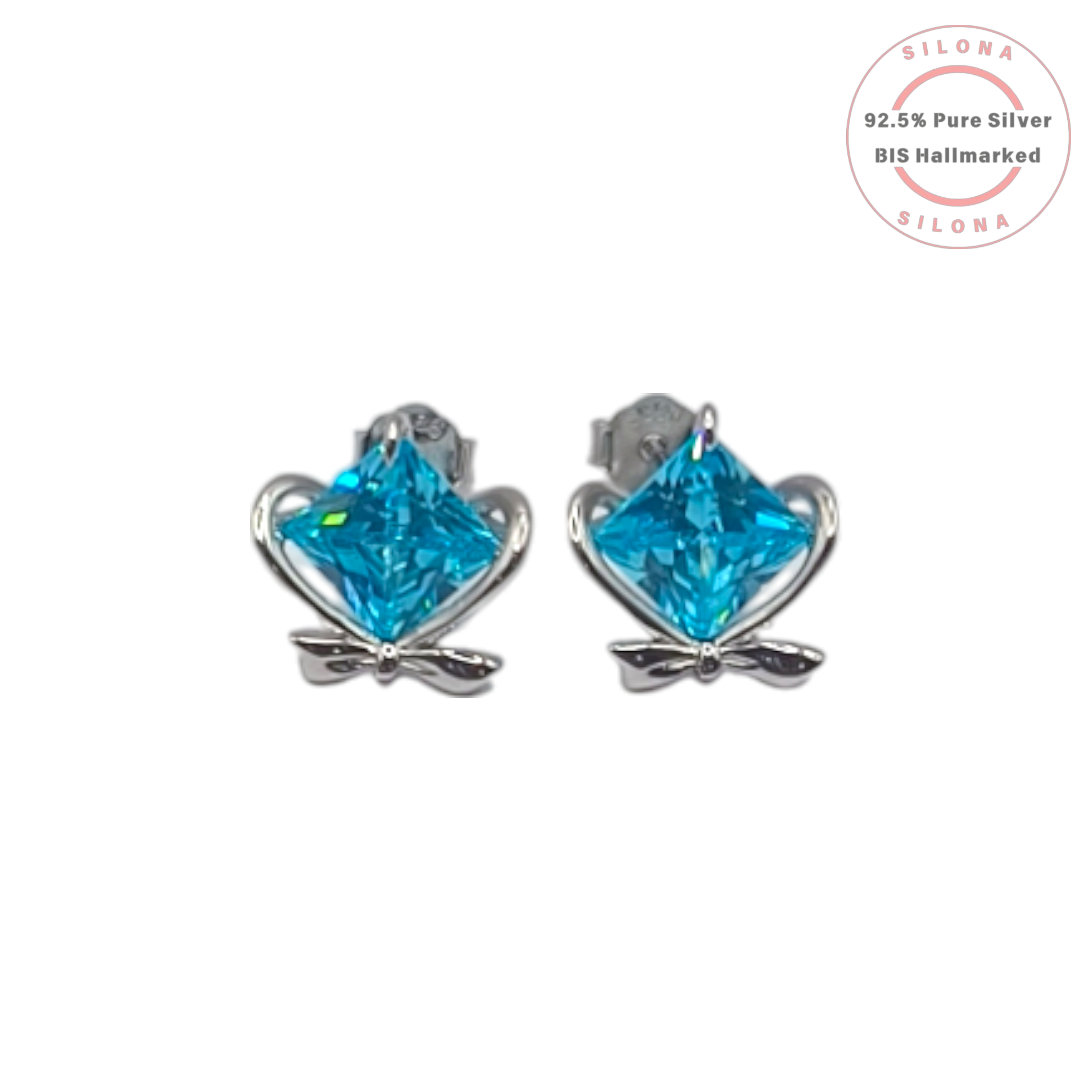 A pair of sterling silver stud earrings featuring a princess-cut, aqua blue cubic zirconia stone set within a delicate heart and bow design, on a white background.