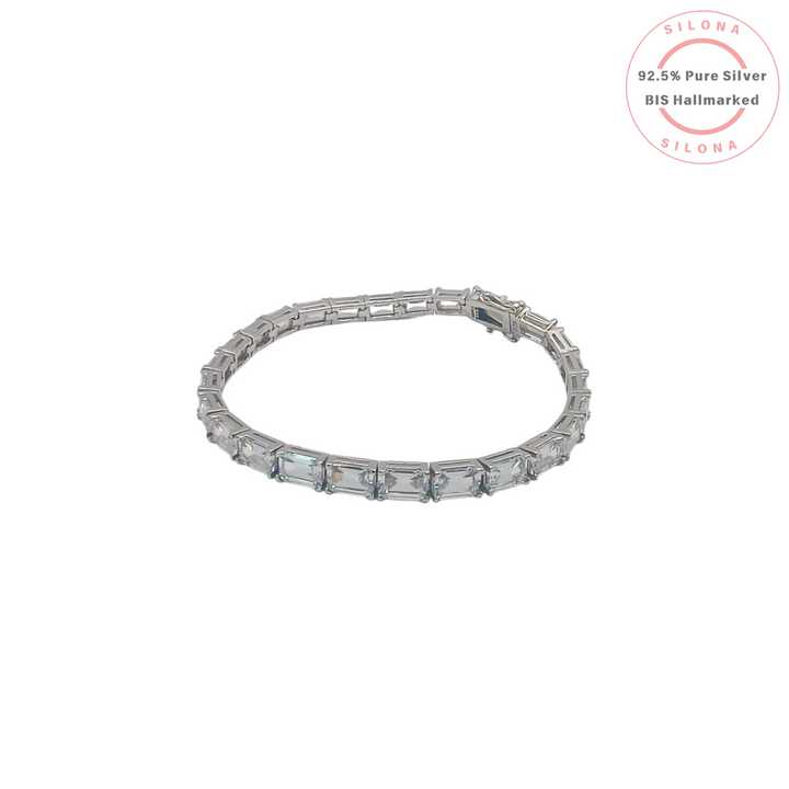 A classic emerald-cut cubic zirconia tennis bracelet in 92.5 silver, shown with its secure clasp on a clean white background.