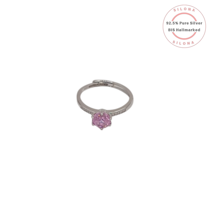 Adjustable solitaire ring in 92.5 silver featuring a round rose pink cubic zirconia stone and a pave-set band.