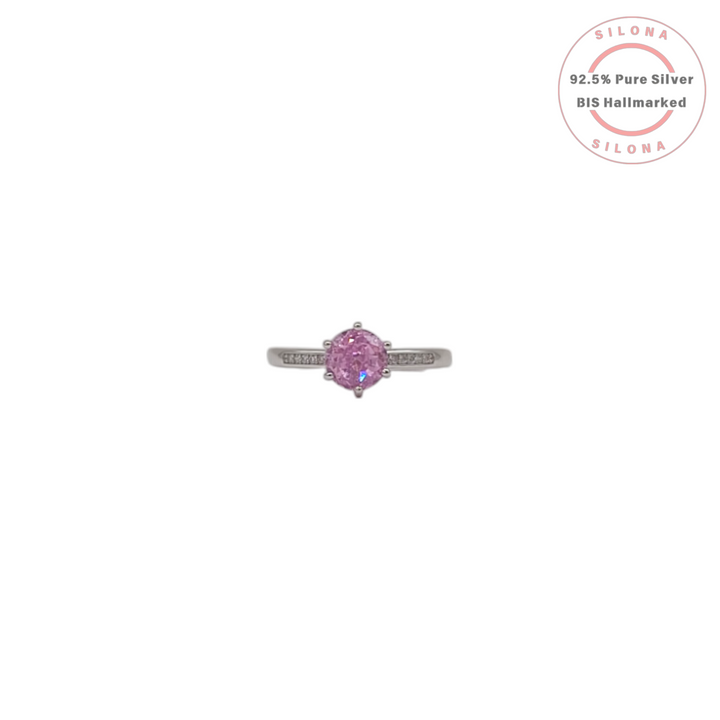Adjustable solitaire ring in 92.5 silver featuring a round rose pink cubic zirconia stone and a pave-set band.