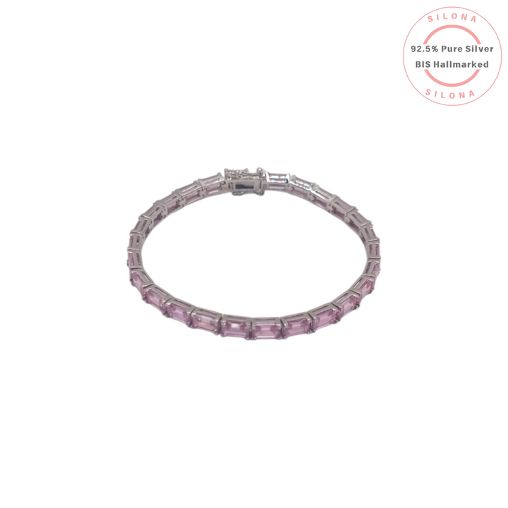 Silona's Modern Rose Pink Baguette Tennis Bracelet in 92.5 sterling silver, featuring a line of rectangular pink stones, on a white background.