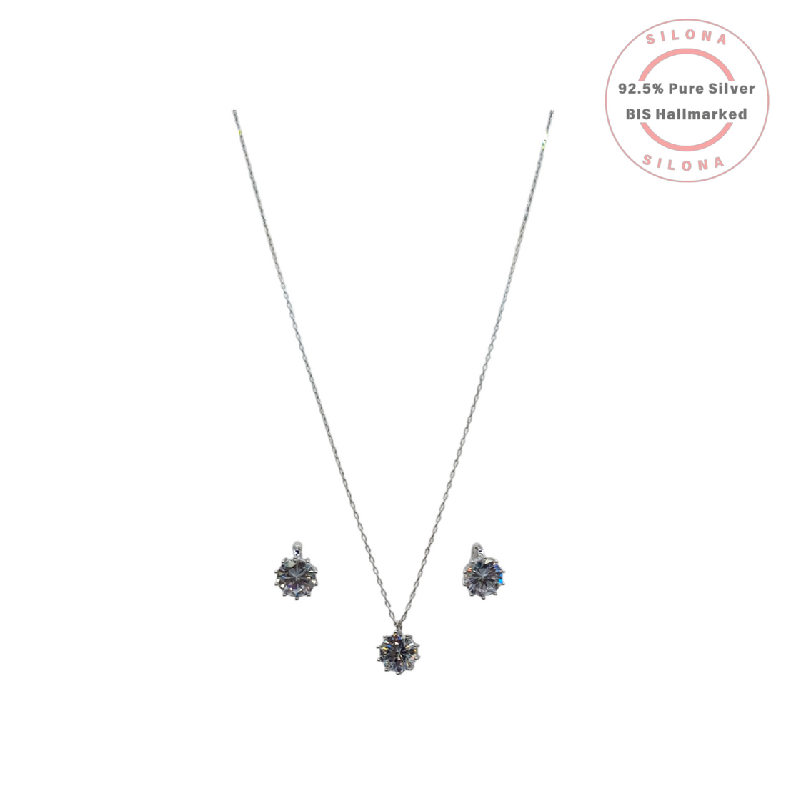 Silona's Classic Solitaire Necklace and Earring Set in 92.5 silver, featuring a brilliant-cut cubic zirconia pendant and matching stud earrings on a white background.