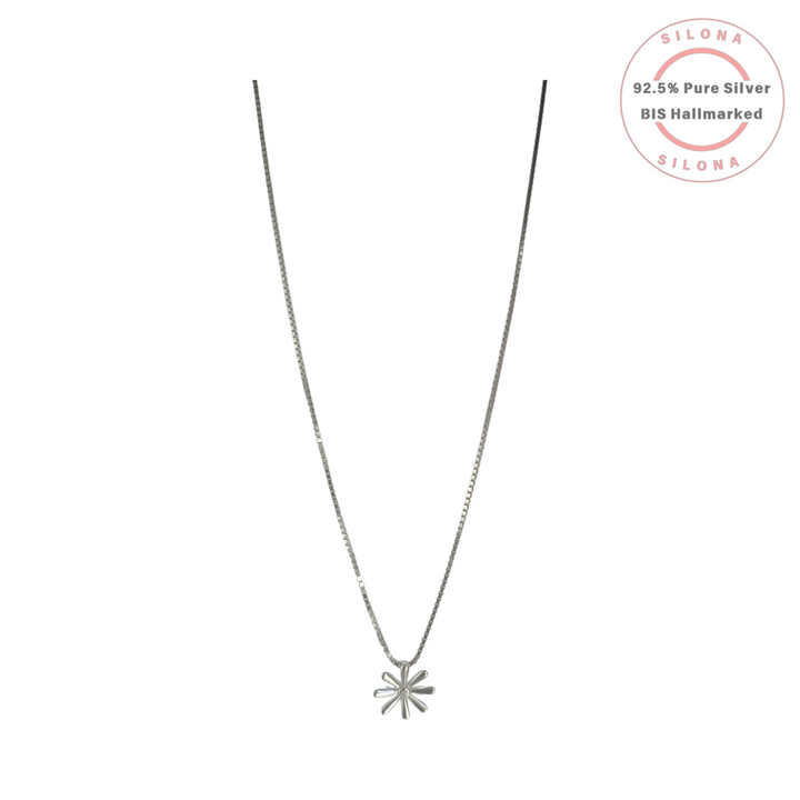 Minimalist daisy pendant necklace in 92.5 silver with a central cubic zirconia on a delicate box chain.