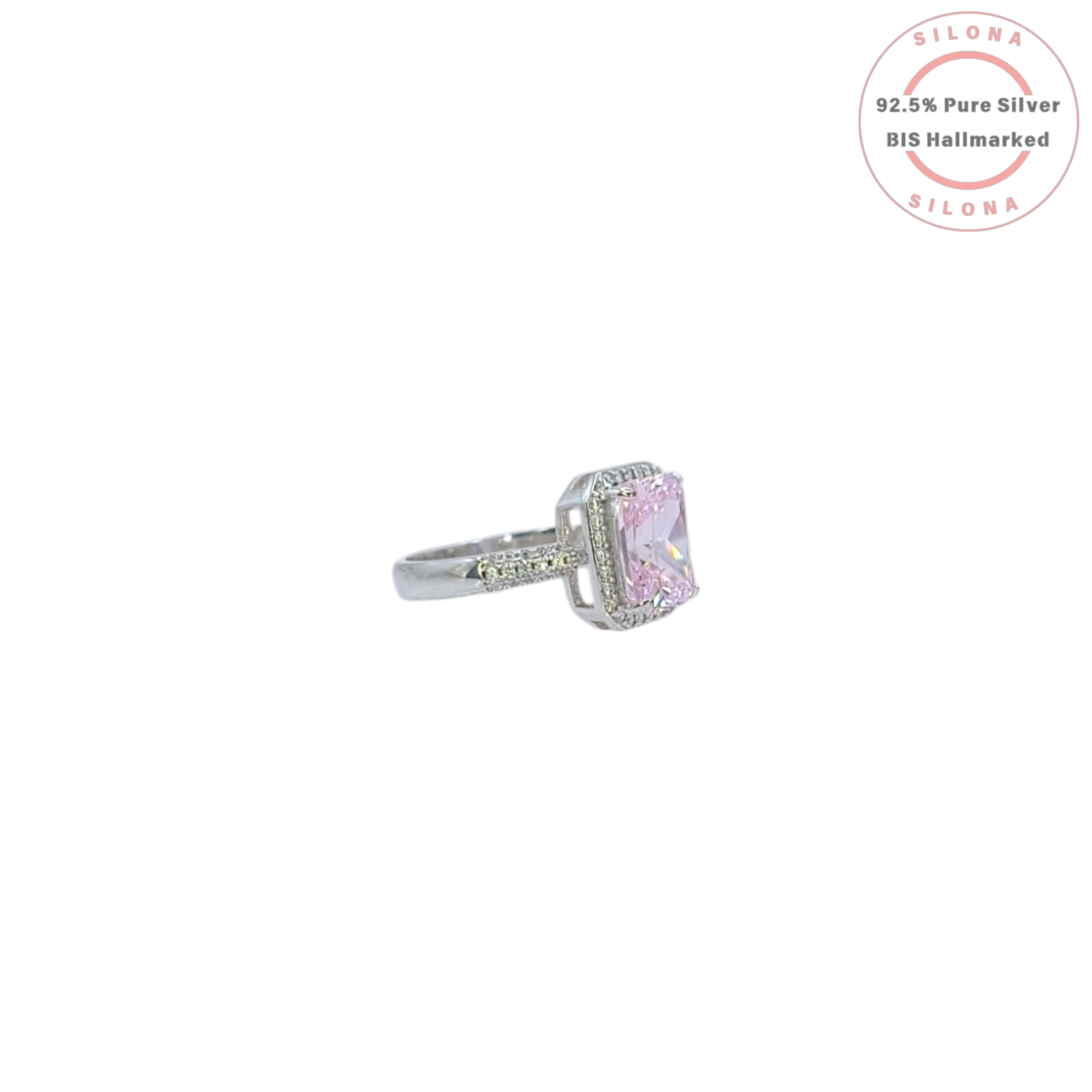 Statement halo ring with a large radiant-cut pink cubic zirconia center stone and a pave band, crafted in pure 92.5 silver.