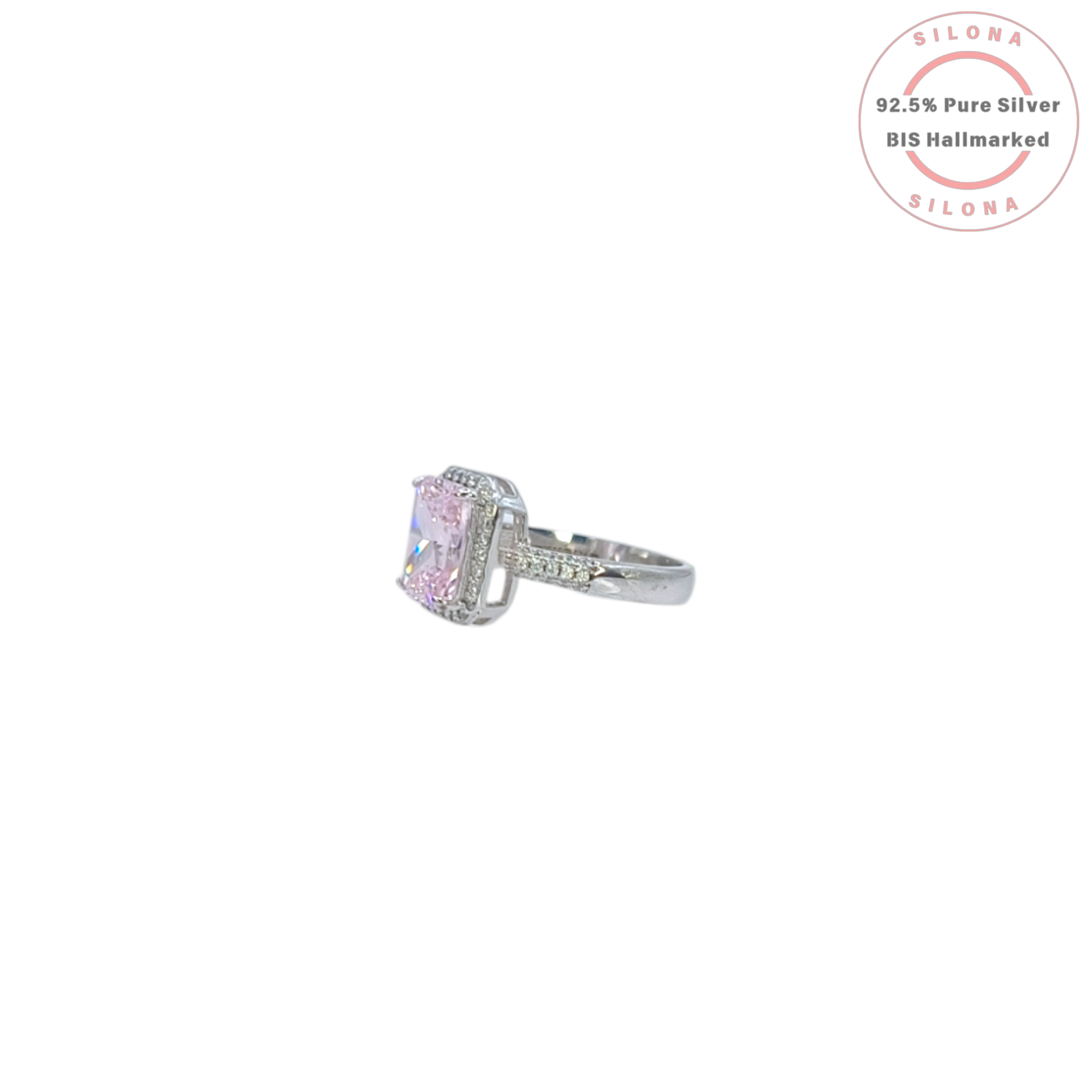 Statement halo ring with a large radiant-cut pink cubic zirconia center stone and a pave band, crafted in pure 92.5 silver.