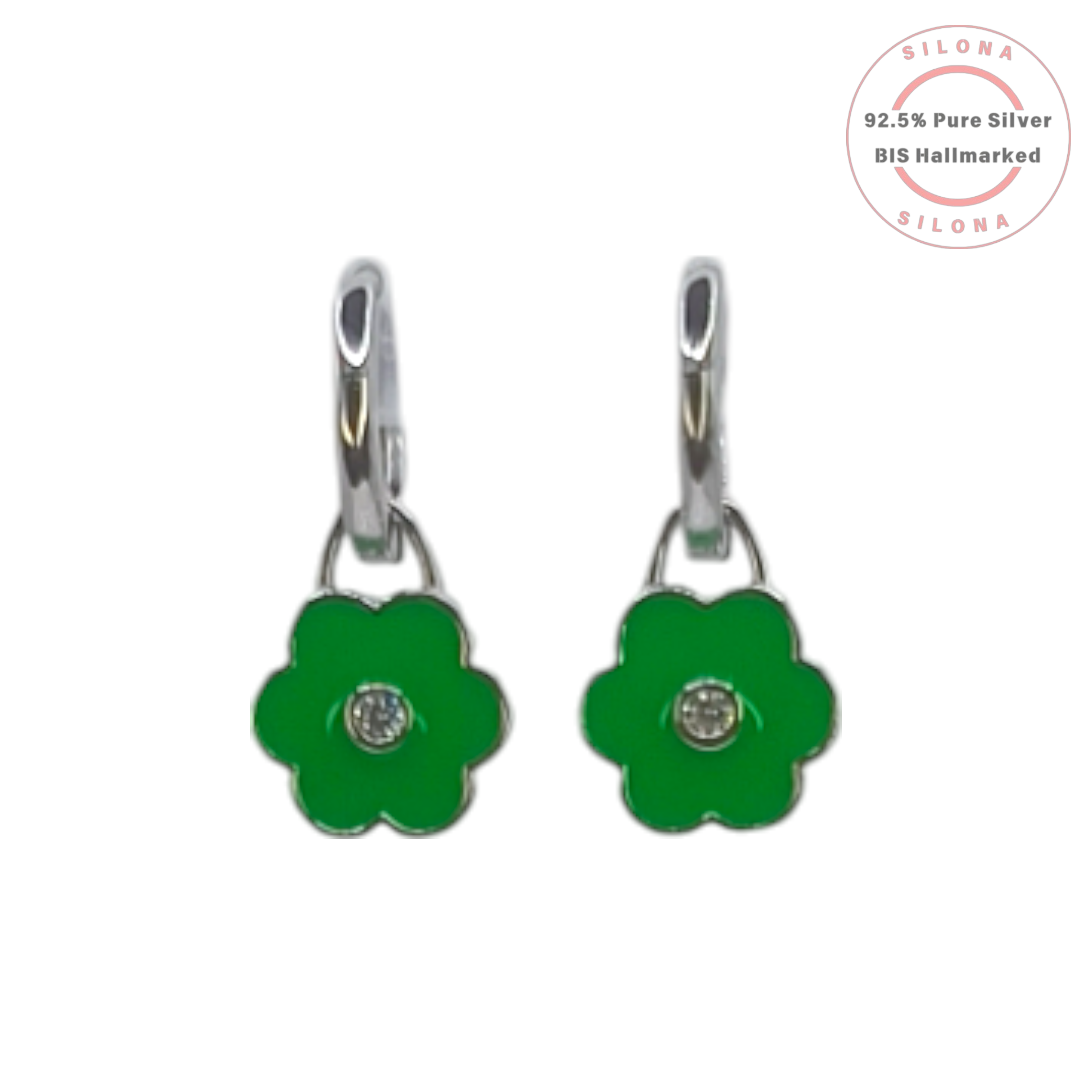 Pair of Silona silver huggie earrings with a dangling green enamel flower charm and a central cubic zirconia stone, on a white background.