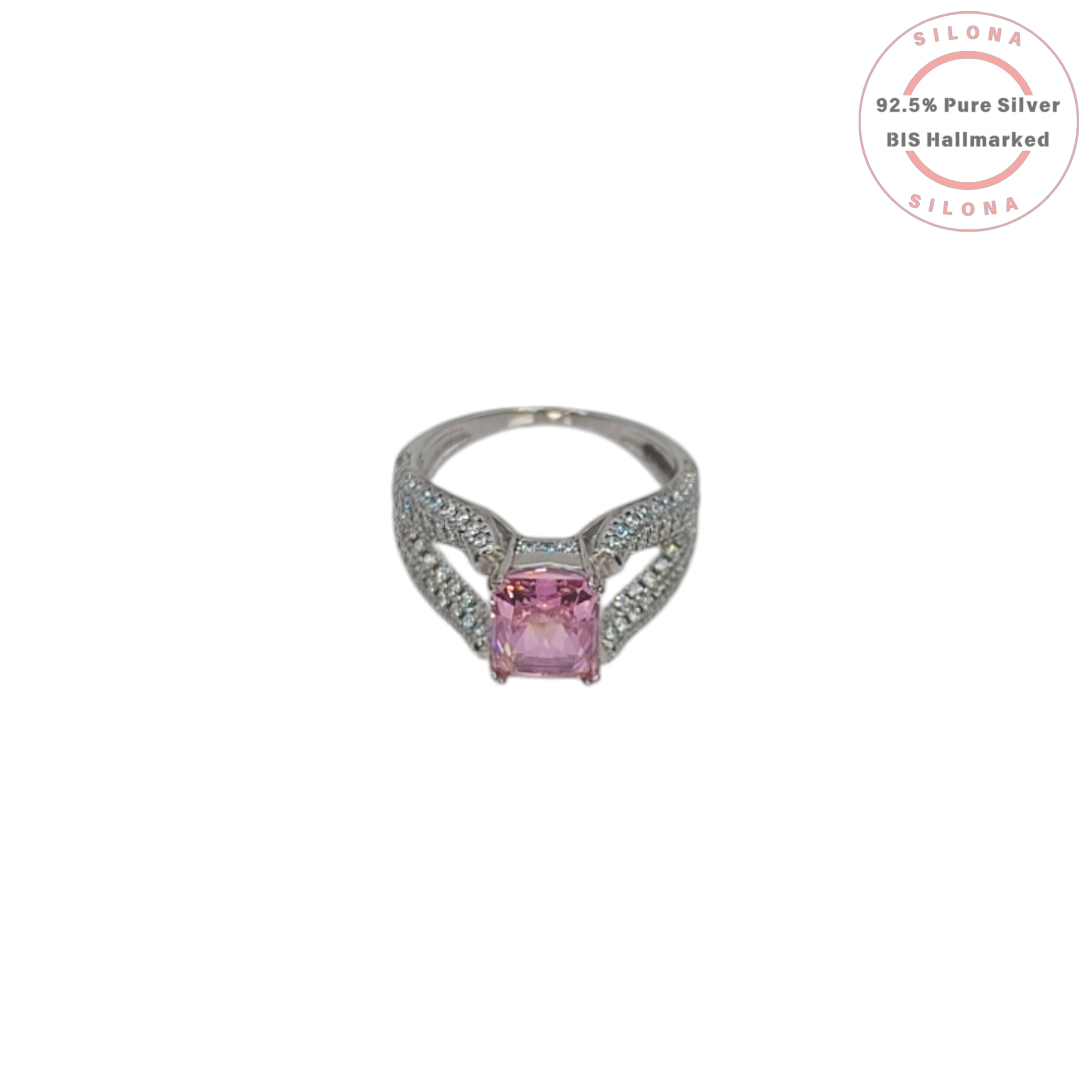 A glamorous statement ring featuring a large, radiant-cut pink cubic zirconia, set on a wide, pavé-encrusted 92.5 silver band.