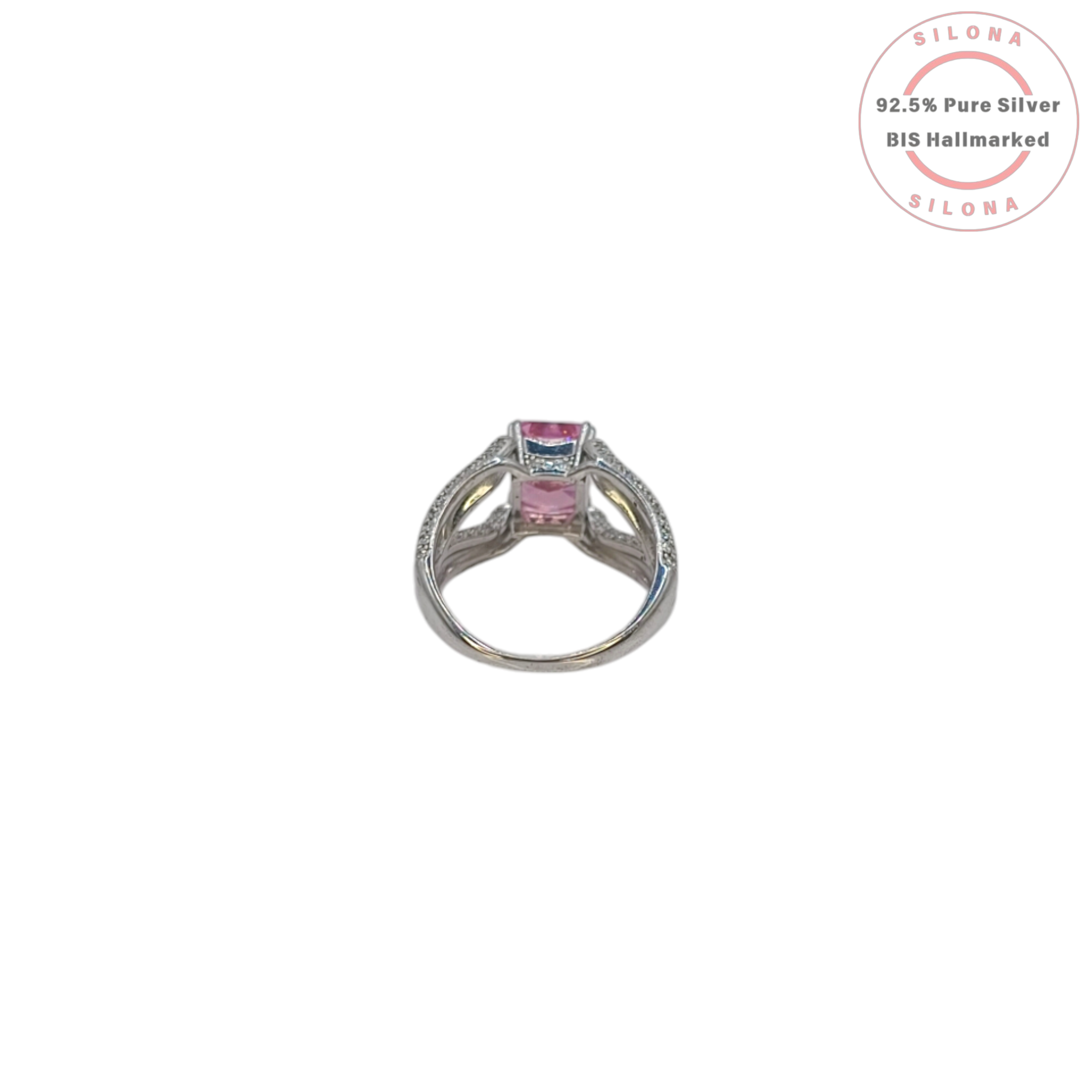 A glamorous statement ring featuring a large, radiant-cut pink cubic zirconia, set on a wide, pavé-encrusted 92.5 silver band.