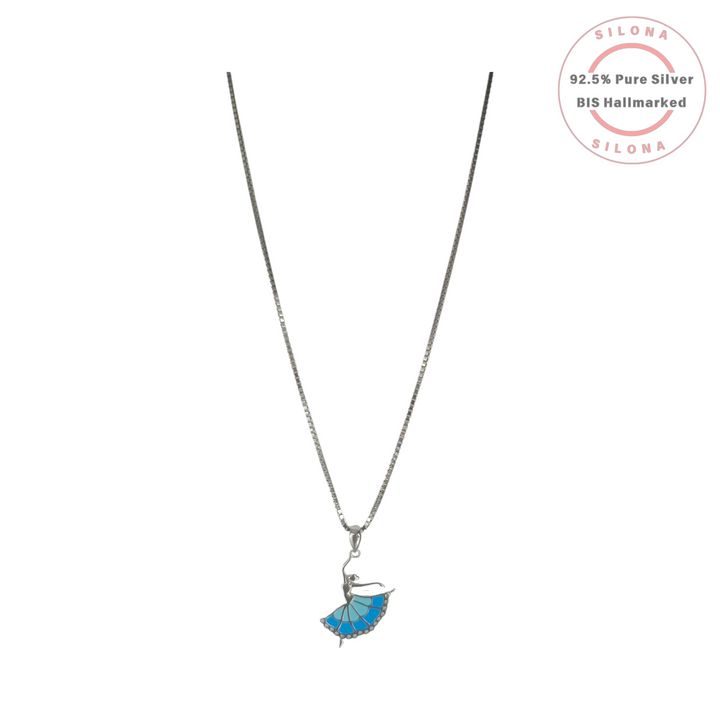 Silona's silver ballerina necklace with a blue enamel tutu, suspended on a silver box chain against a white background.