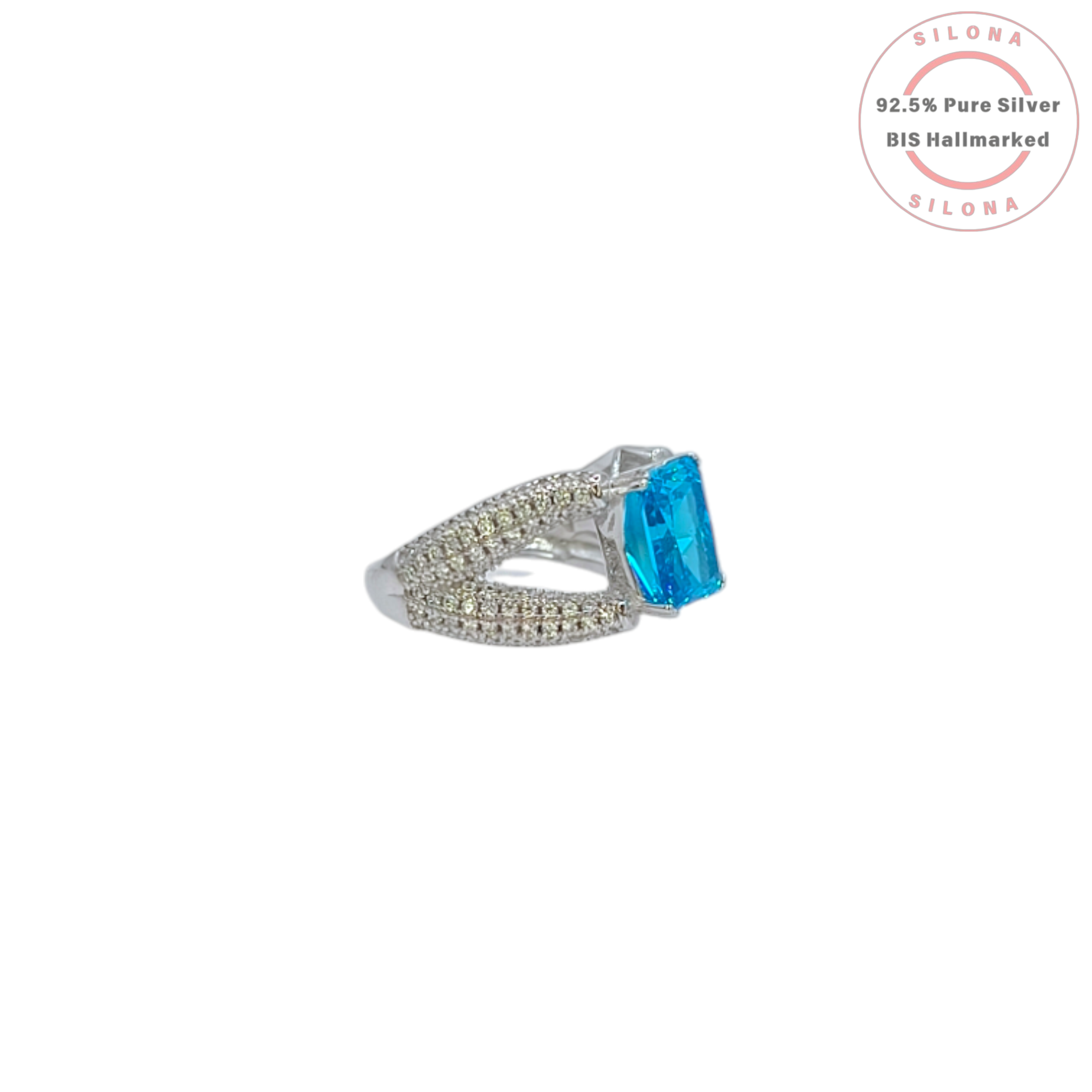 Statement silver ring featuring a large, rectangular Swiss blue cubic zirconia, set on a pavé-encrusted split shank band.