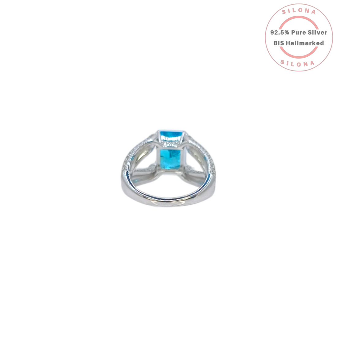 Statement silver ring featuring a large, rectangular Swiss blue cubic zirconia, set on a pavé-encrusted split shank band.