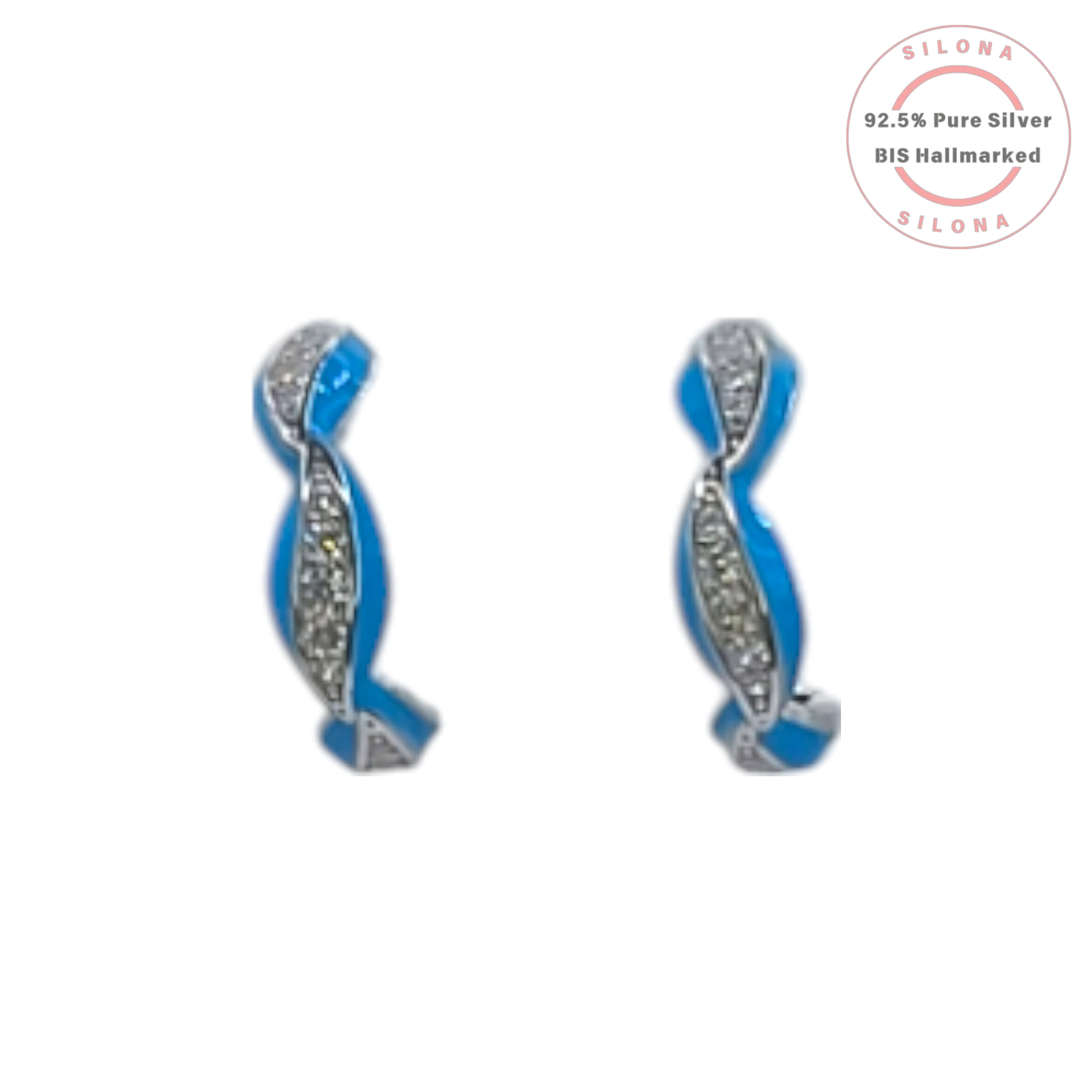 Pair of Silona twist huggie earrings in 92.5 silver, featuring one strand of vibrant blue enamel and another of pavé-set cubic zirconia, on a white background.