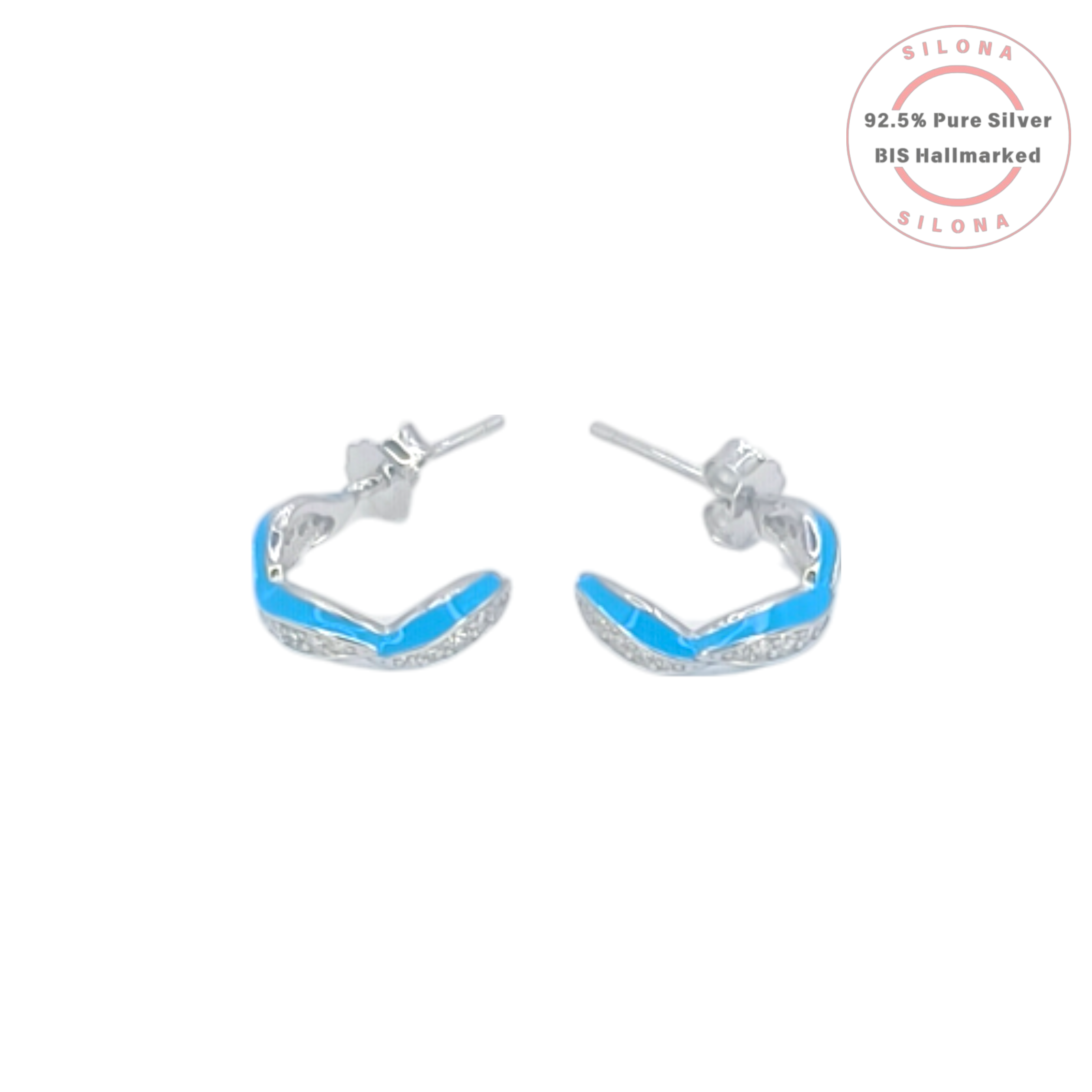 Pair of Silona twist huggie earrings in 92.5 silver, featuring one strand of vibrant blue enamel and another of pavé-set cubic zirconia, on a white background.