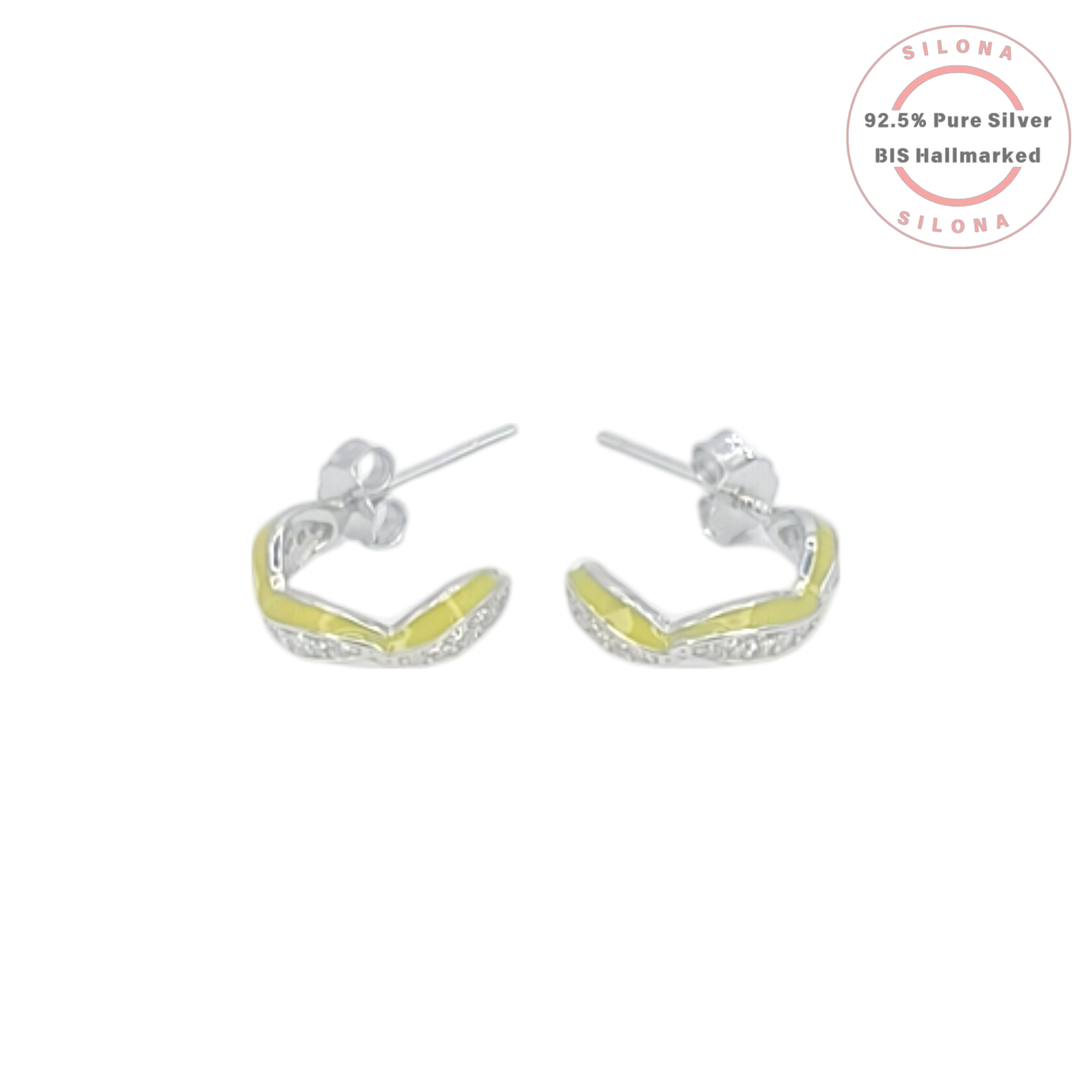 A pair of Silona silver twist huggie earrings with chartreuse green enamel and a pave-set line of cubic zirconia stones, on a white background.