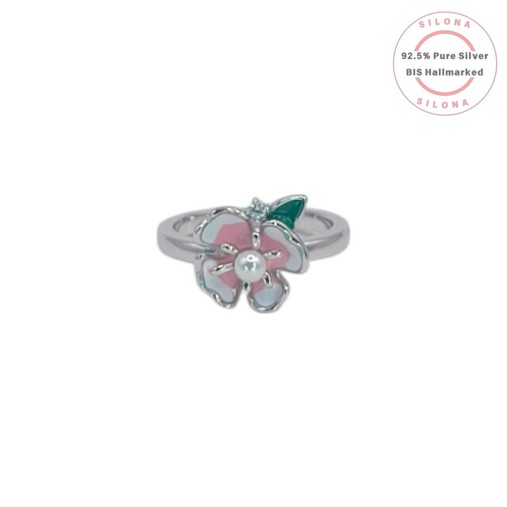 Silona Enamel Blossom Ring in 92.5 silver, featuring a pink and white enamel flower with a central pearl and green leaf detail.