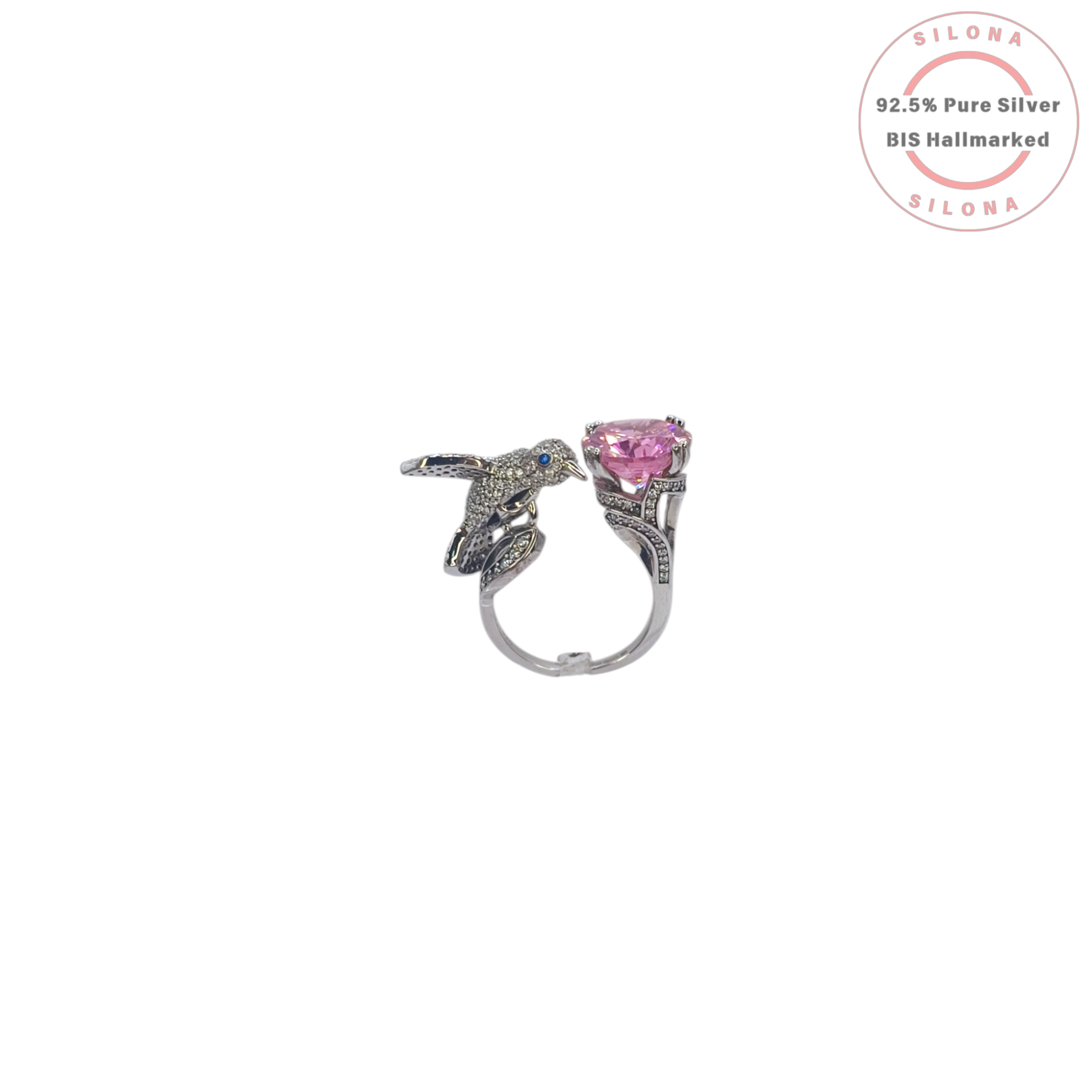 Silona Whimsical Hummingbird Ring in 92.5 Silver, featuring a pavé-set bird motif with a blue eye and a large round pink cubic zirconia stone on an open shank.
