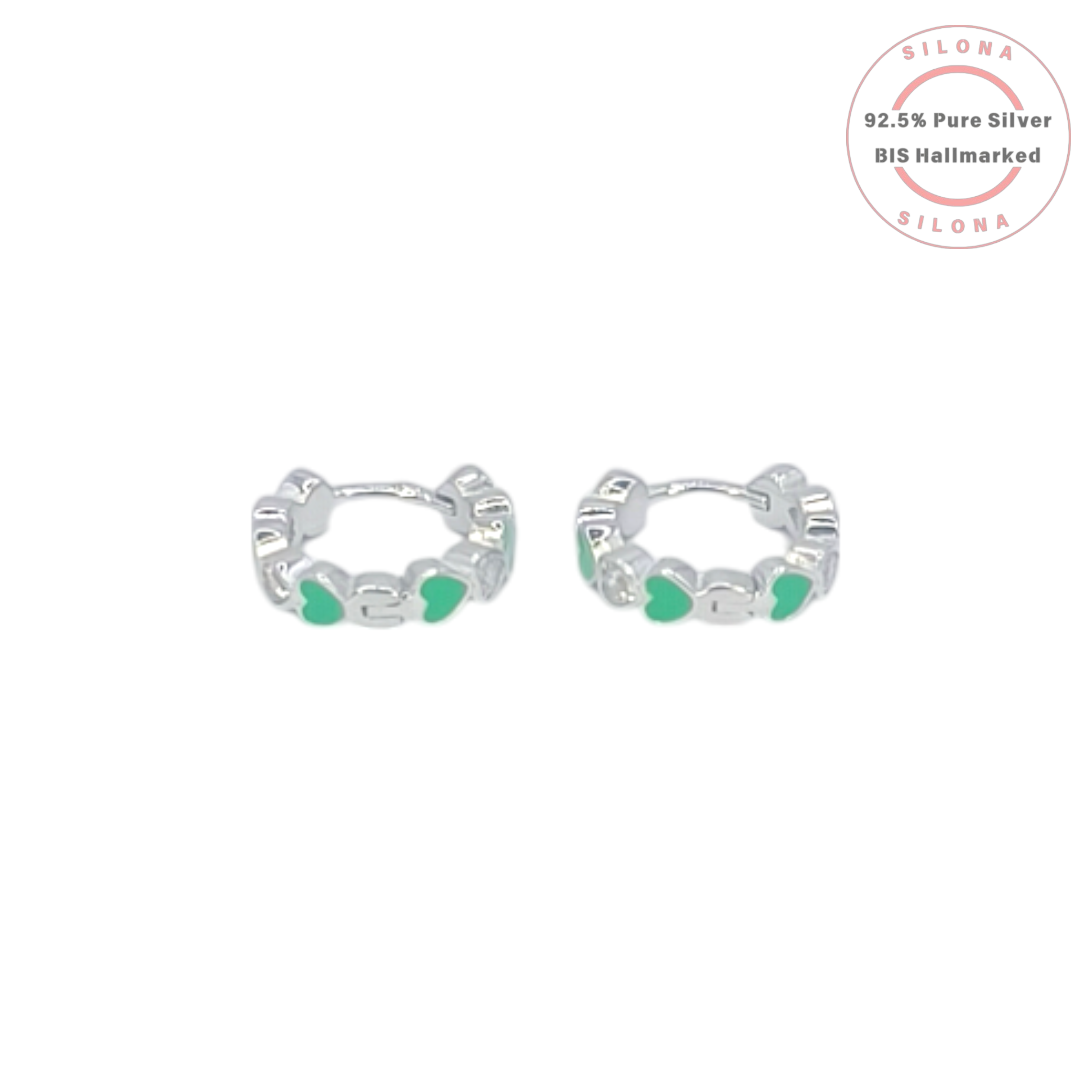 A pair of Silona silver huggie hoop earrings with an alternating pattern of vibrant green enamel hearts and sparkling heart-shaped cubic zirconia stones, shown on a white background.