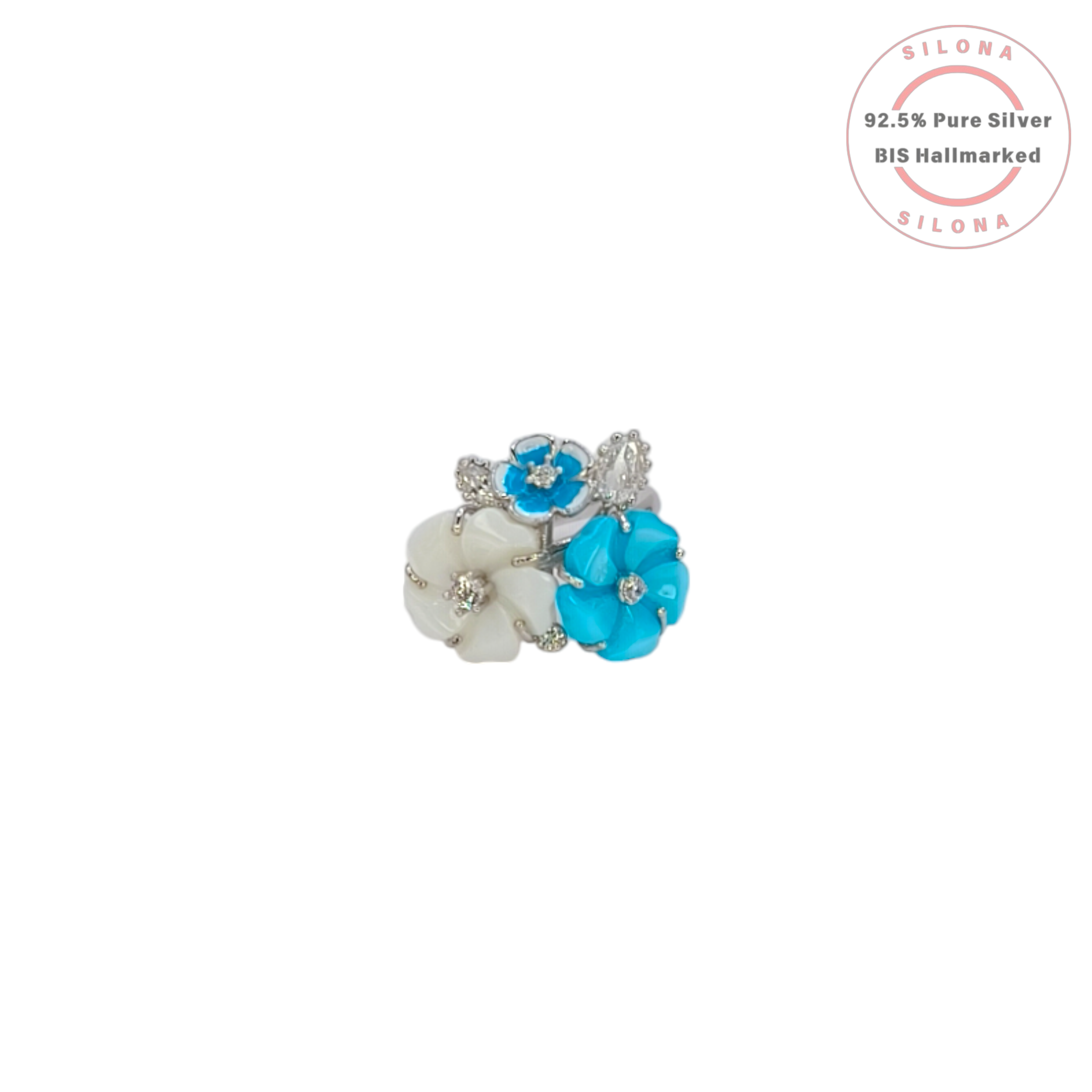 Side view of a floral cluster ring in sterling silver, featuring turquoise blue and mother of pearl petals surrounding a central clear stone.