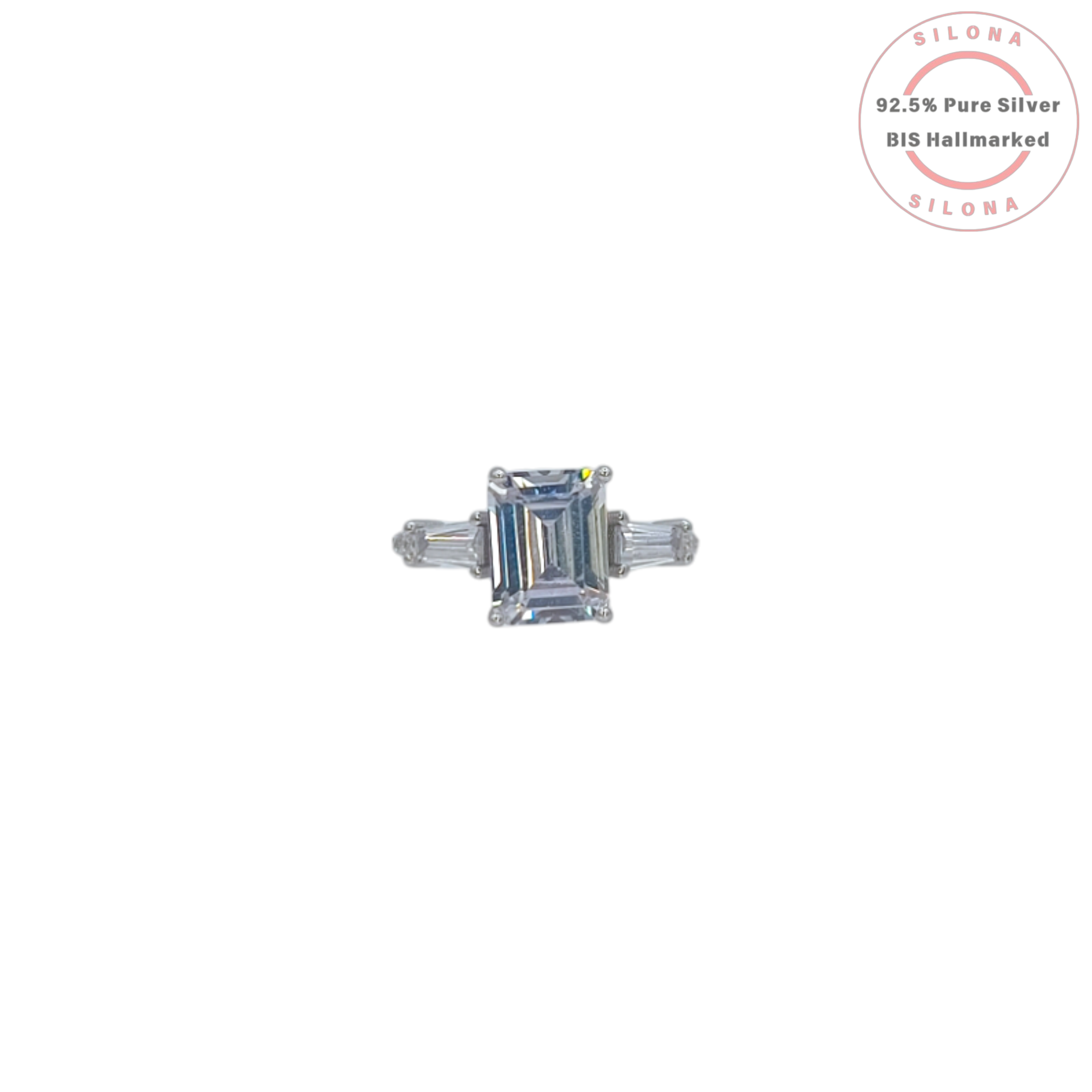 Front view of a statement emerald-cut and baguette cubic zirconia ring, crafted in sterling silver, on a white background.