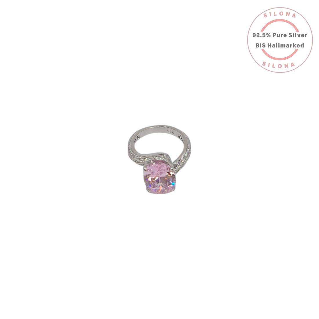 Front view of a statement silver ring featuring a large oval-cut pink cubic zirconia stone with a pavé-set split shank band on a white background.