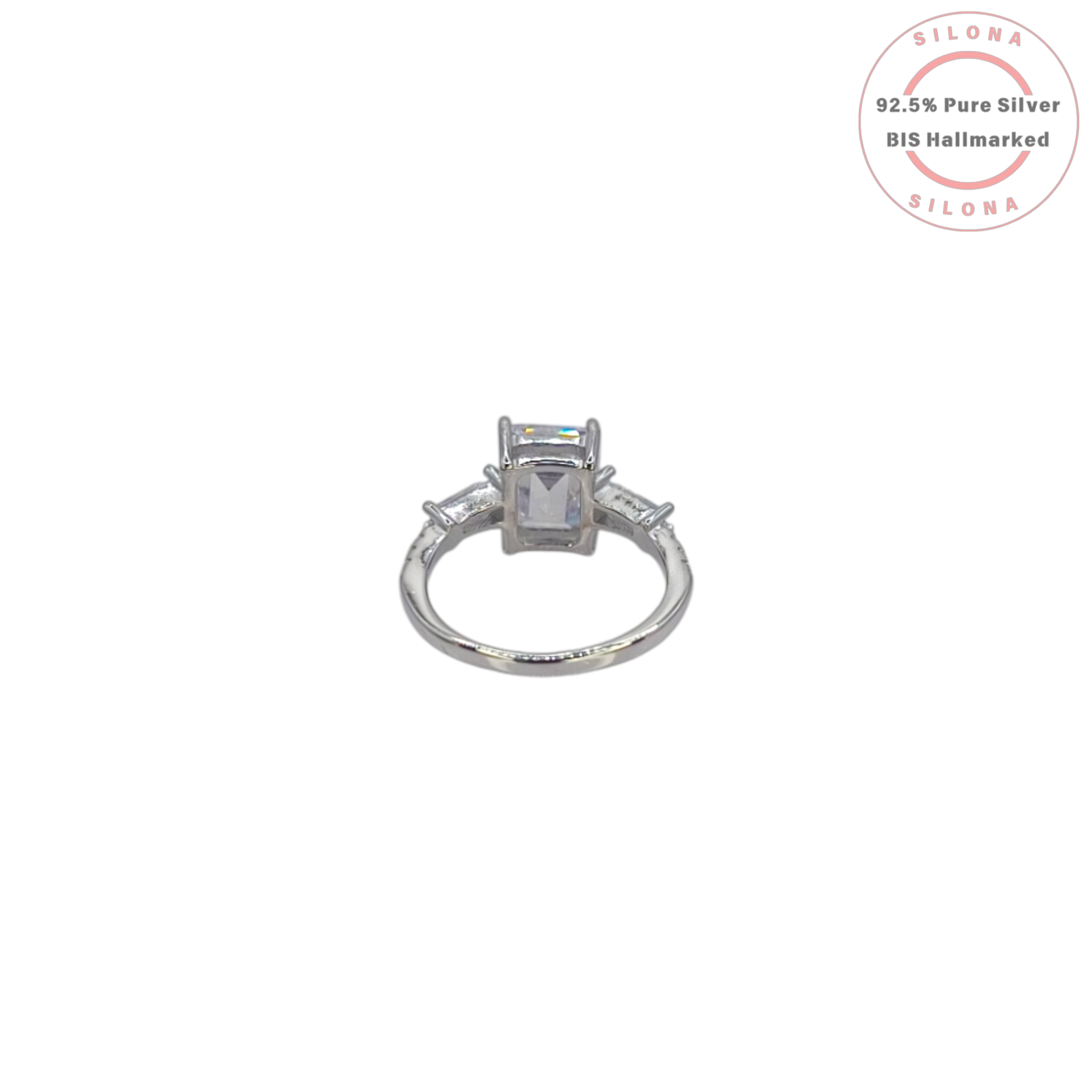 Front view of a statement emerald-cut and baguette cubic zirconia ring, crafted in sterling silver, on a white background.